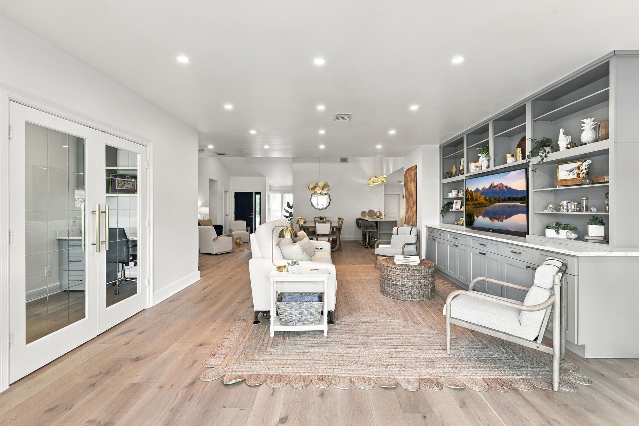 The opposite side of the living room has an entrance to the office.