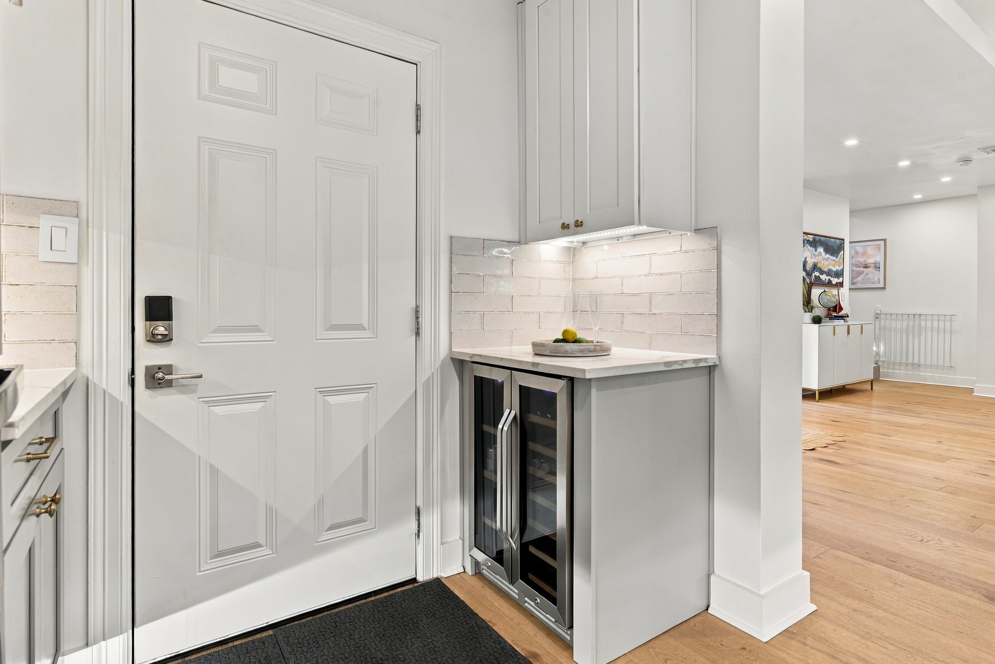 The kitchen leads to the back yard and grill area, perfect for an outdoor kitchen.