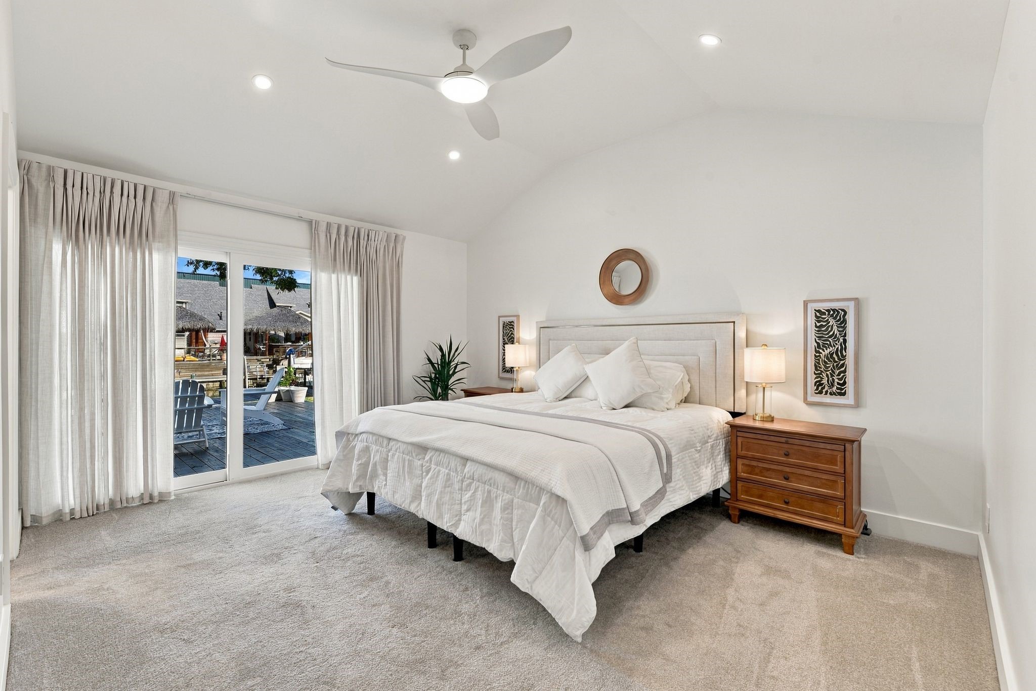 The Primary Bedroom has vaulted ceilings and a view of the water, and is located on the first floor.
