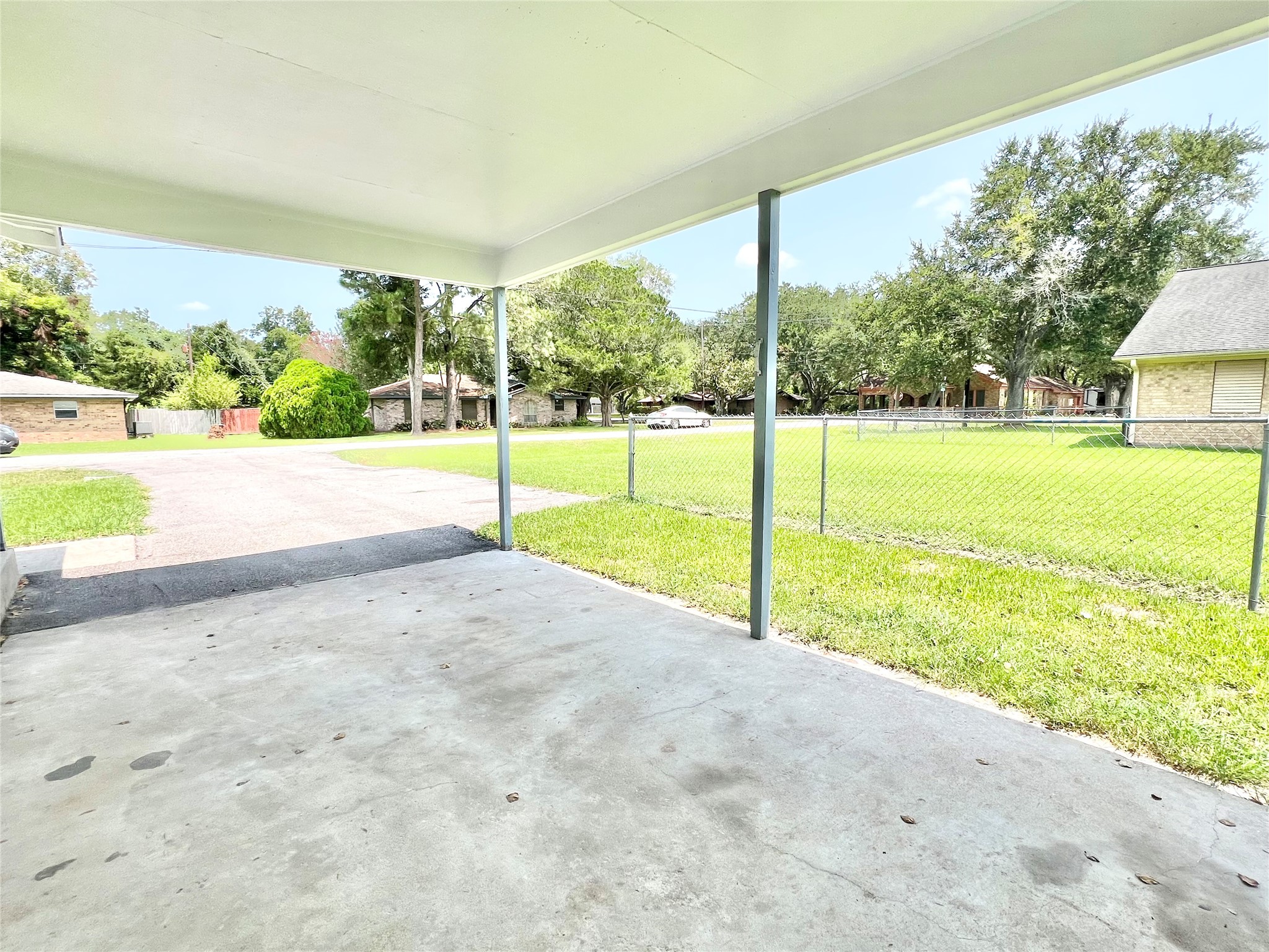 View from under the carport, nice homes all around.