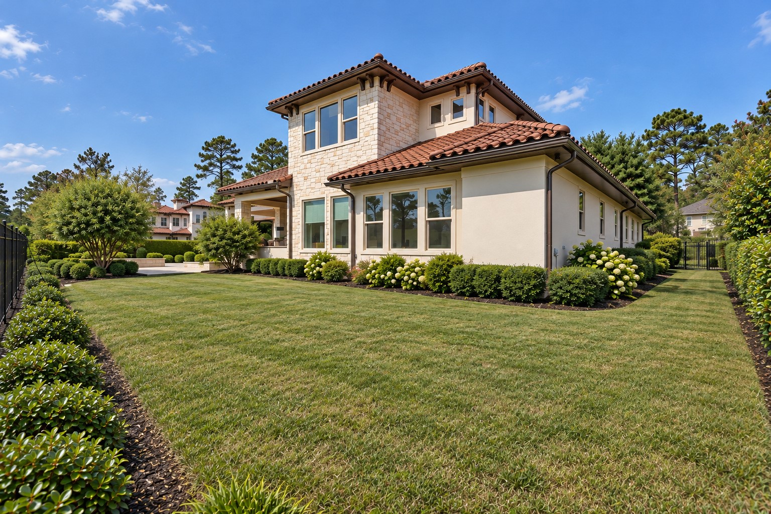 Beautifully landscaped backyard featuring lush green lawn, mature trees, and manicured gardens. A peaceful outdoor setting with plenty of space to relax and enjoy the surrounding views.