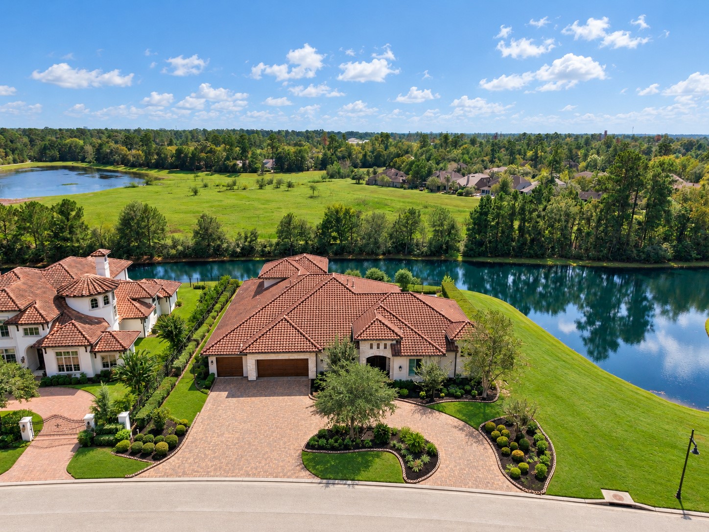 Exceptional luxury estate situated on a picturesque peninsula, surrounded by tranquil water on both sides and offering breathtaking panoramic views.