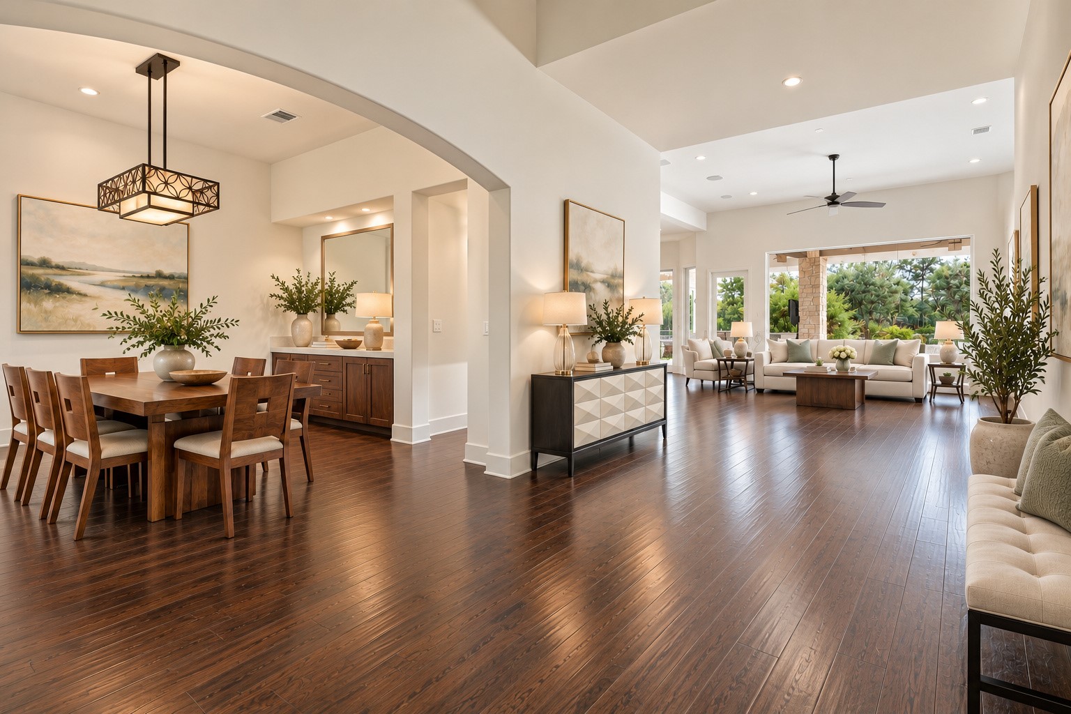 Beautiful open-concept layout seamlessly connects the elegant formal dining room and spacious living area, featuring soaring ceilings, rich hardwood floors, and abundant natural light.