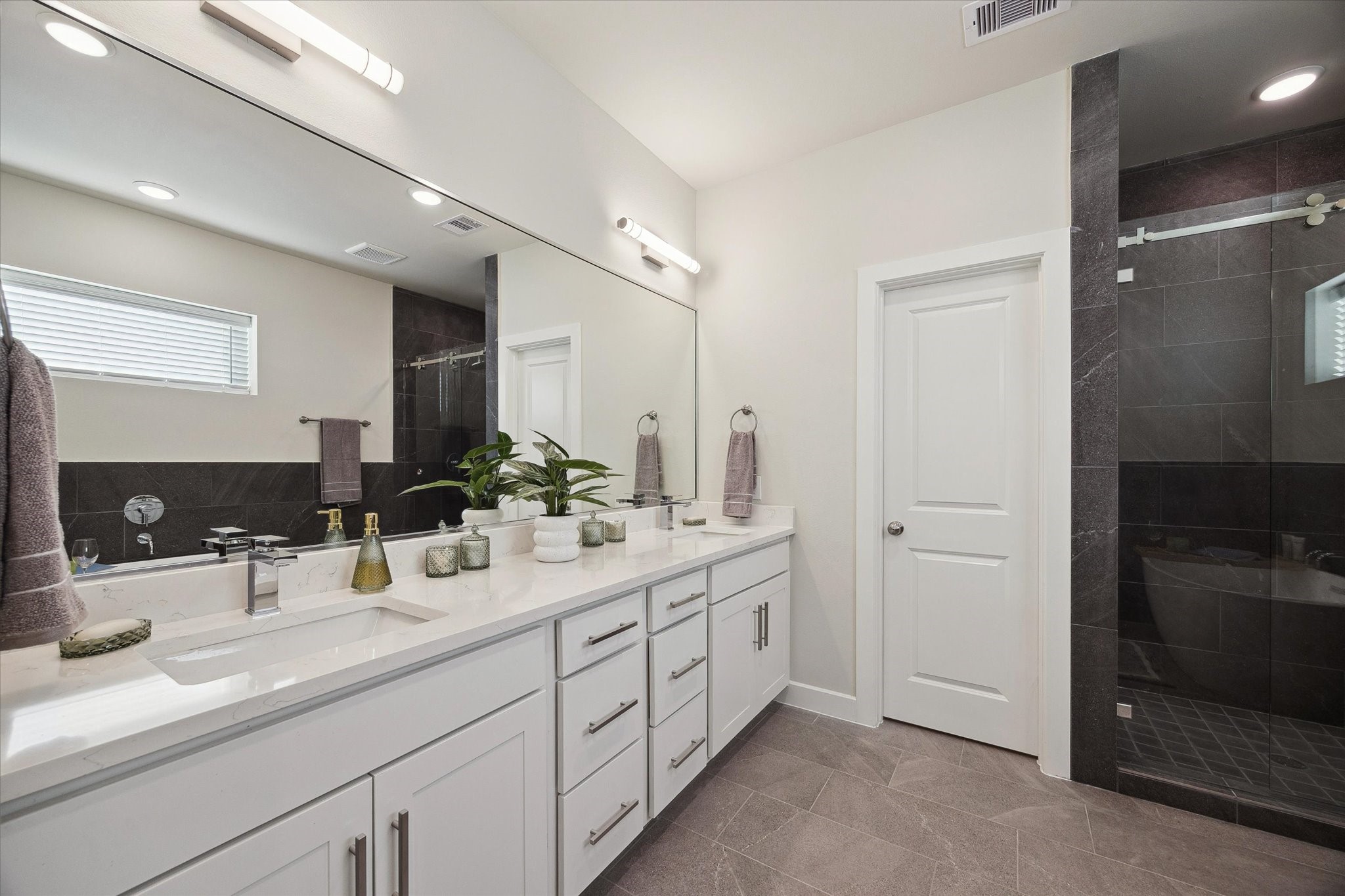 Representative photo showing the communitys model home primary bathroom. Layout and selections may vary.
