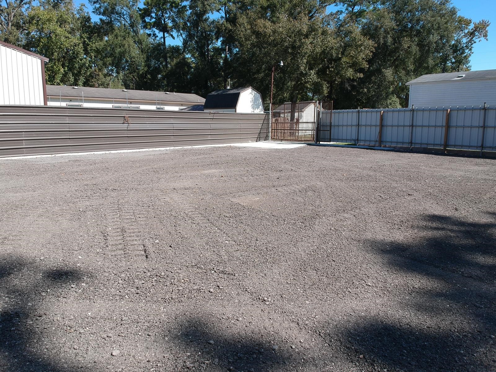 Fully gated back lot, fresh gravel recently poured