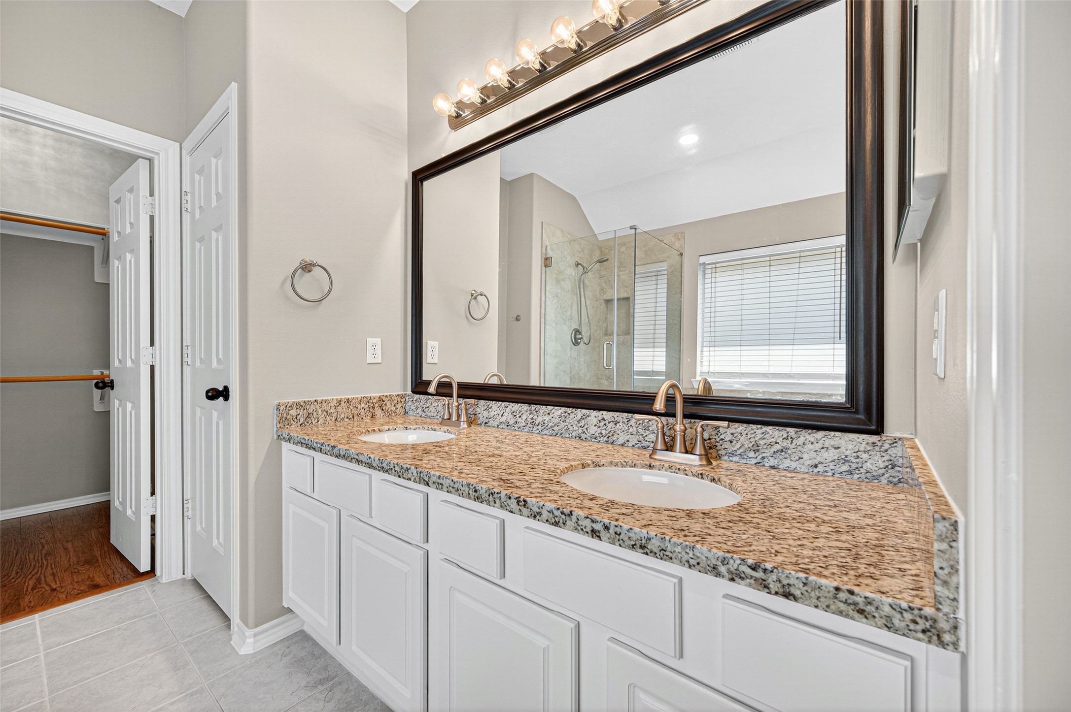 Dual sink vanity with framed mirror