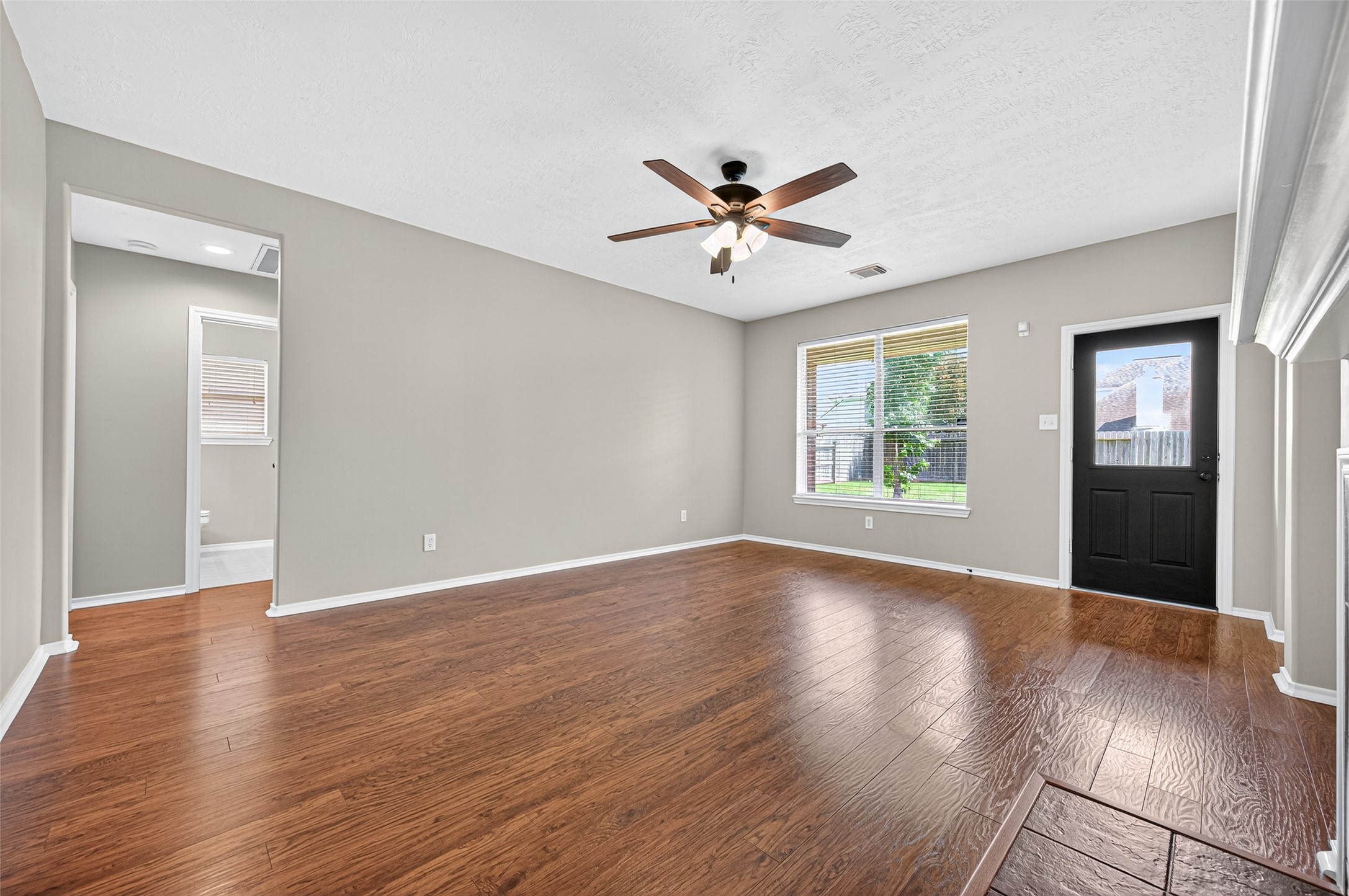 Large Family Room overlooking back patio and yard