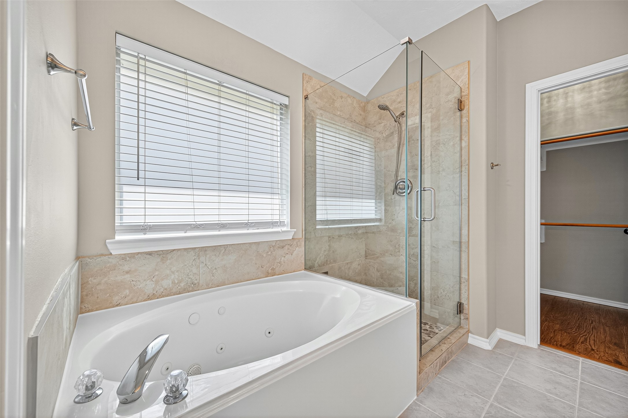 Jetted tub and seamless glass shower