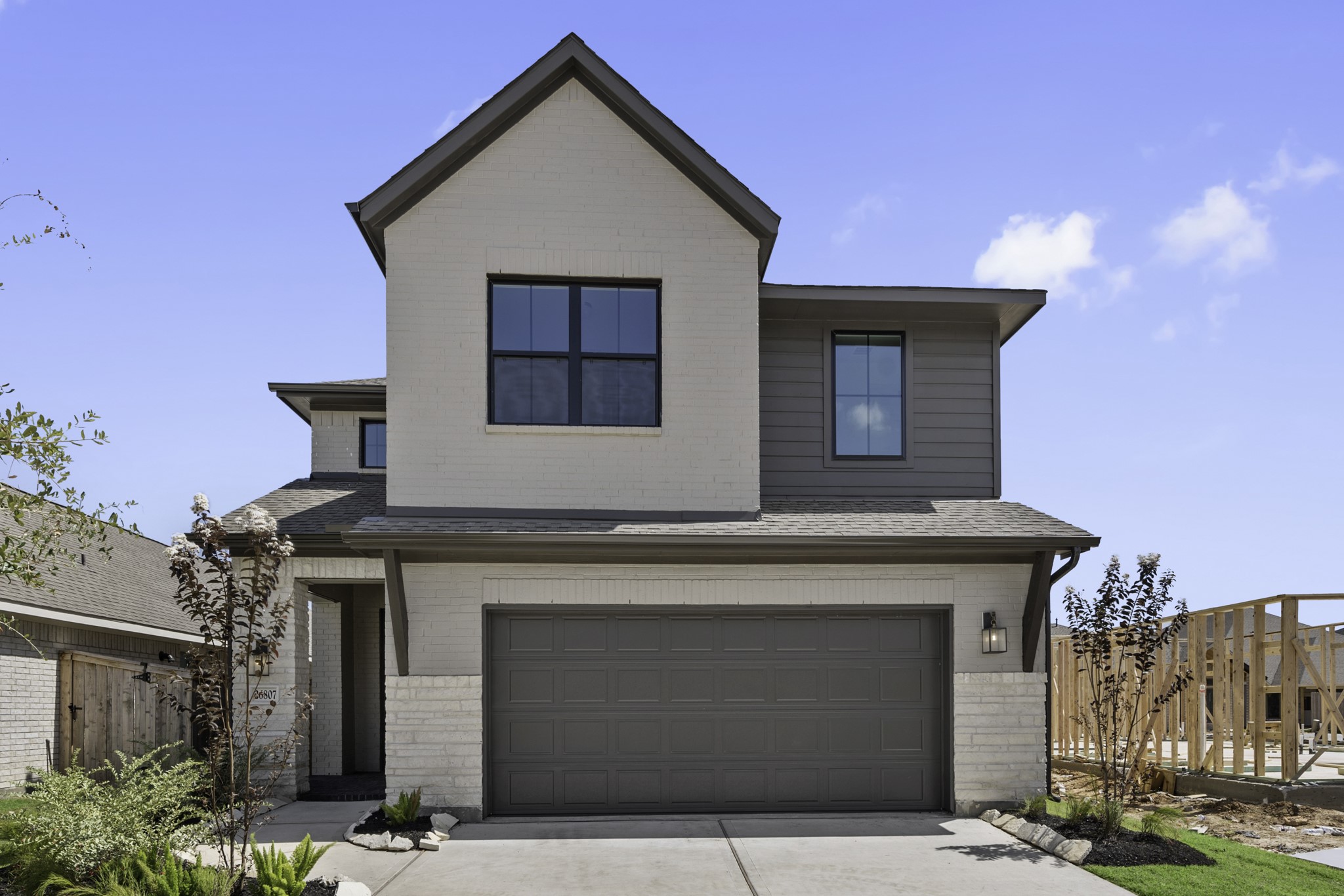 Move-In Ready! Westin Homes | Retreat II New Construction. Grass is digitally enhanced.