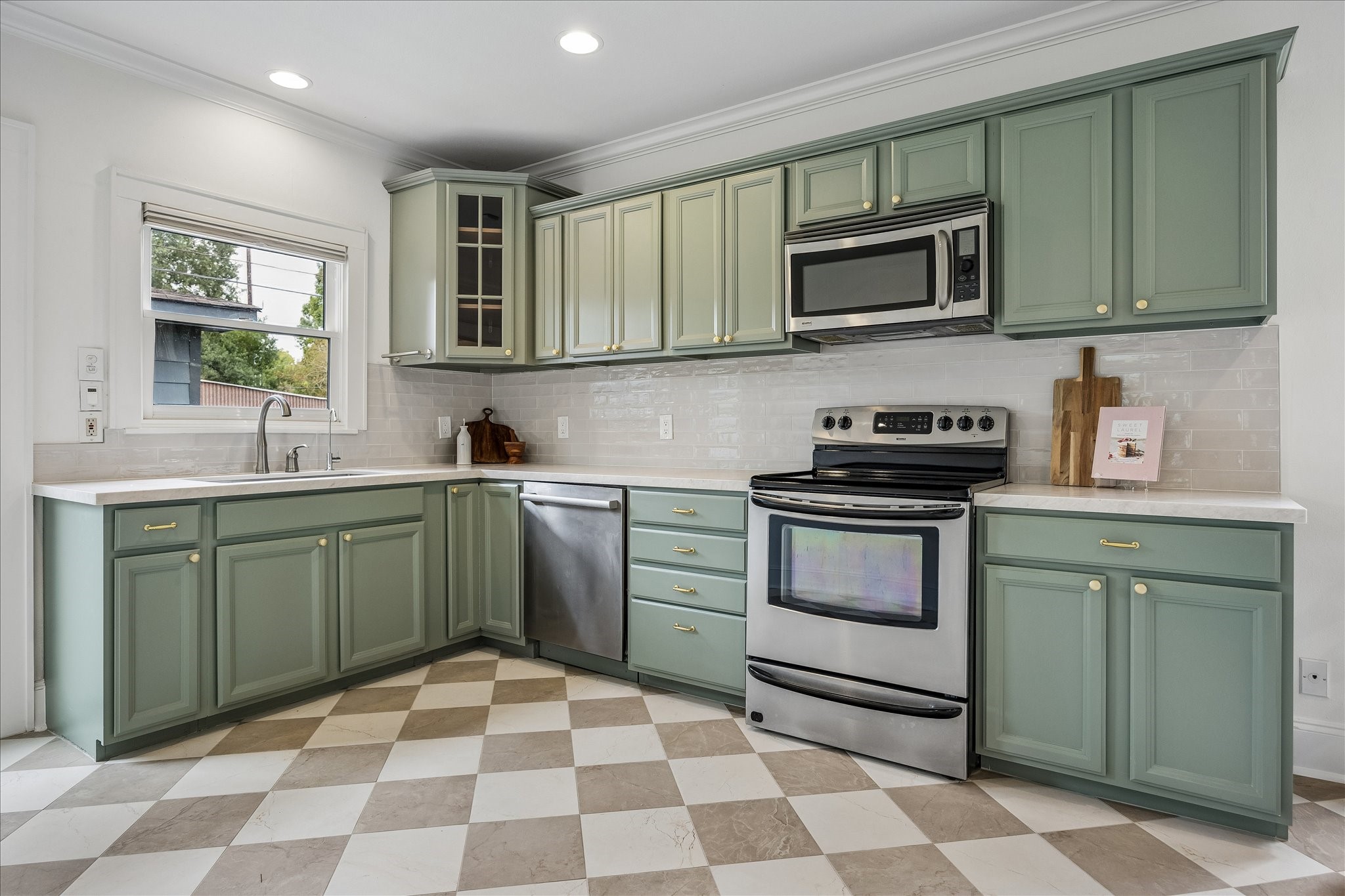Stainless steel appliances, and a breakfast nook.