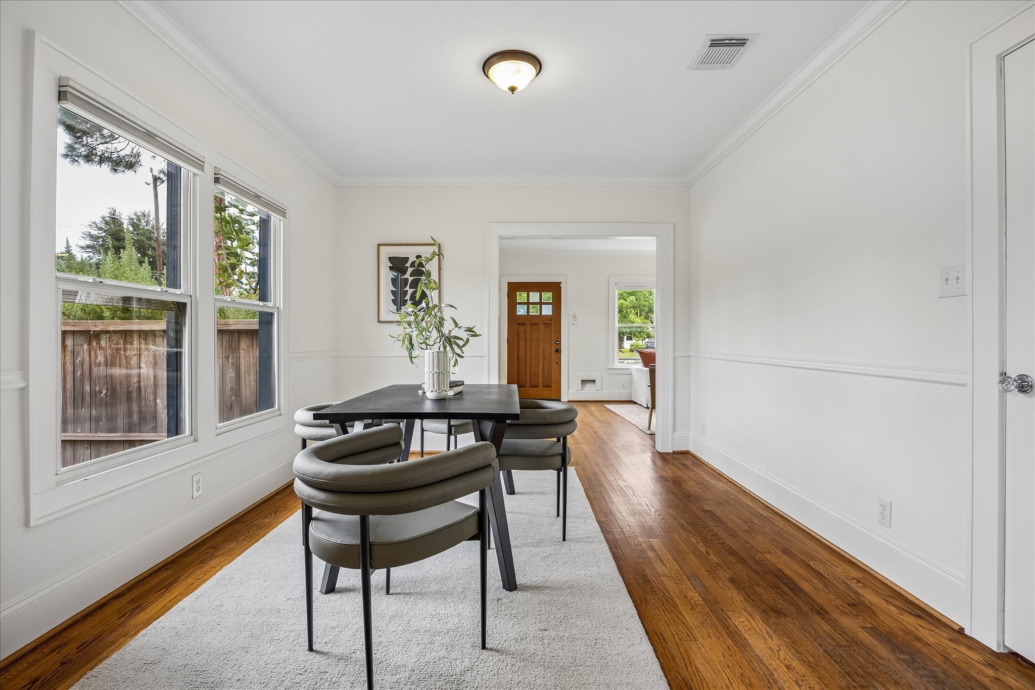 Living opens to a light-filled formal dining room