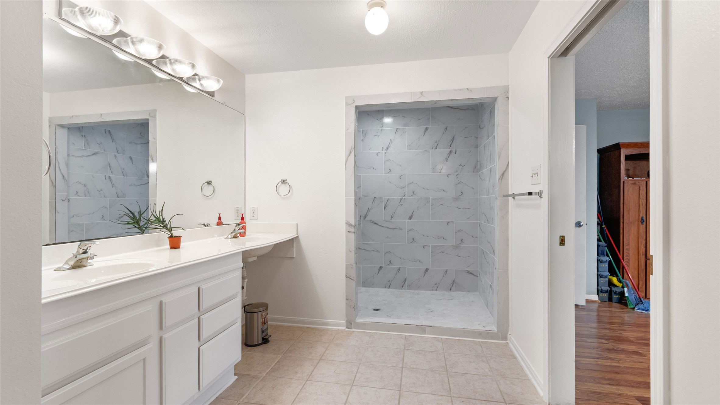 The second primary bathroom was designed with accessibility in mind, including a wheelchair accessible layout.