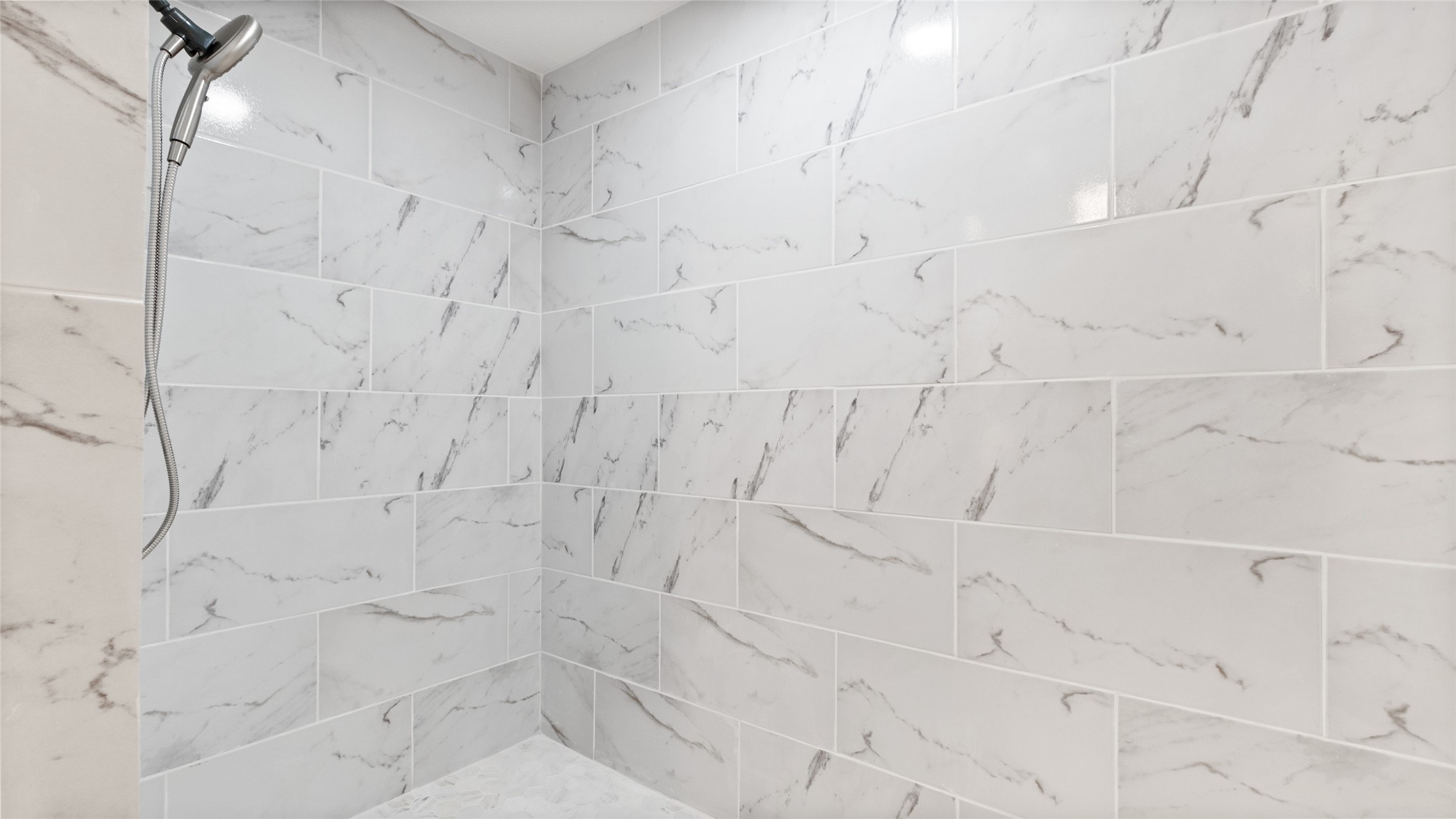 The walk in shower offers wheelchair accessibility and plenty of space for easier movement.