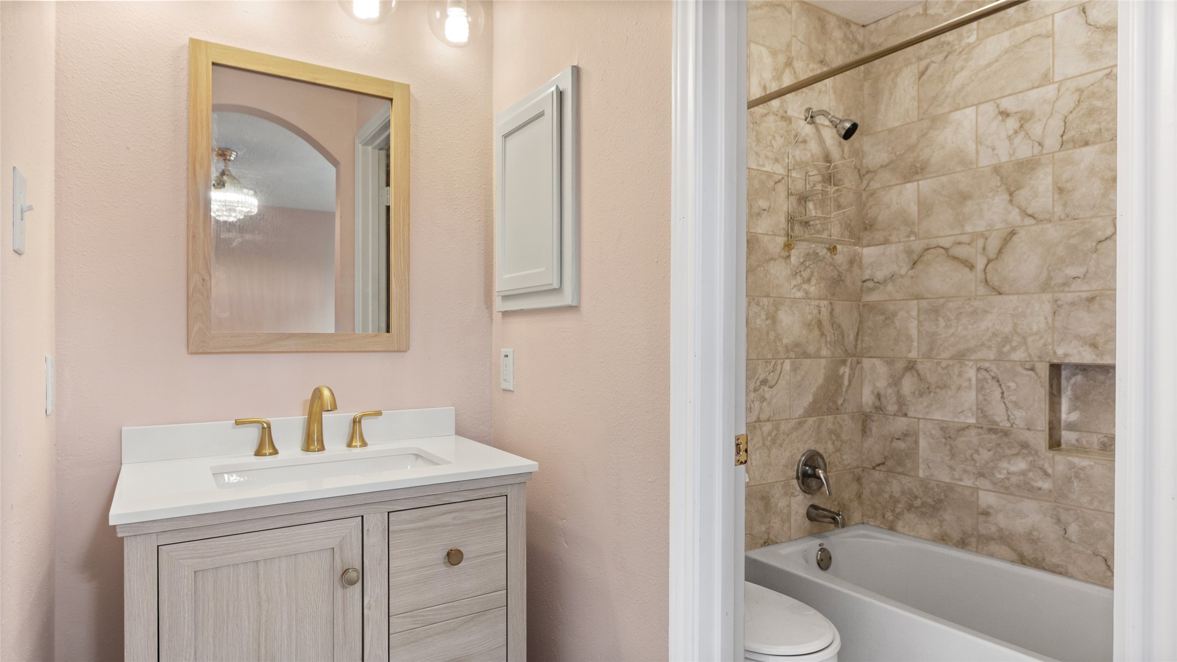 A full bath attached directly to the upstairs bedroom creates a private guest retreat.