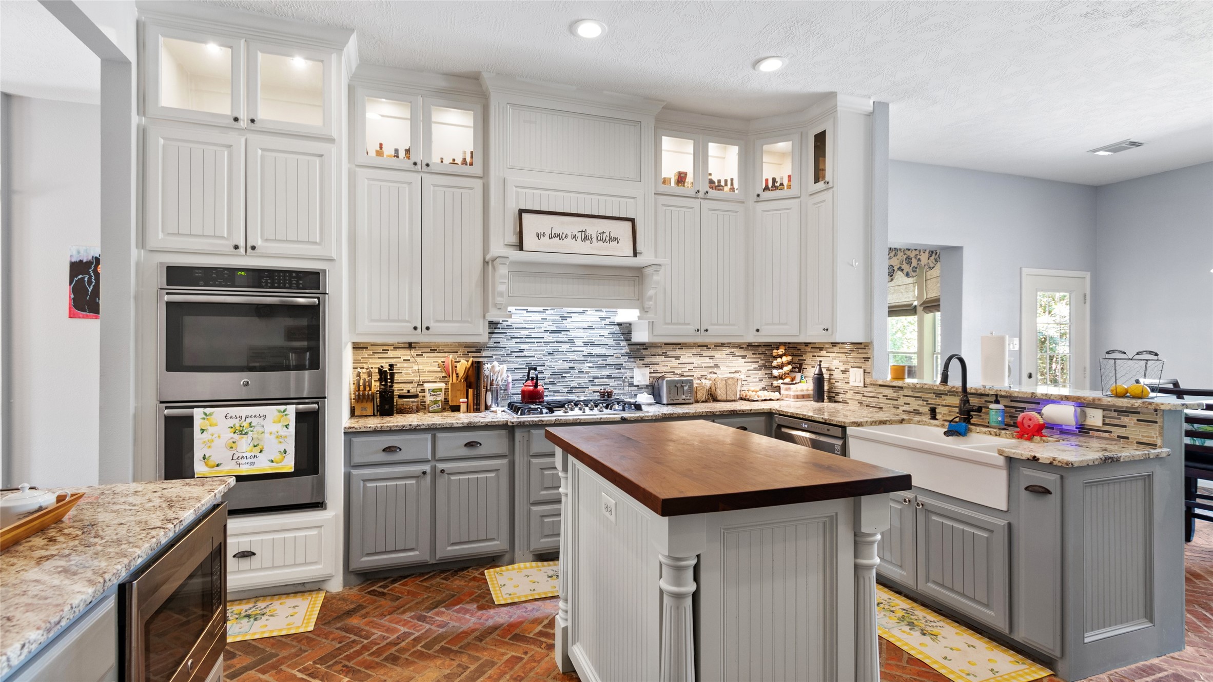 Spacious kitchen with granite counters, double ovens and plenty of room to gather.