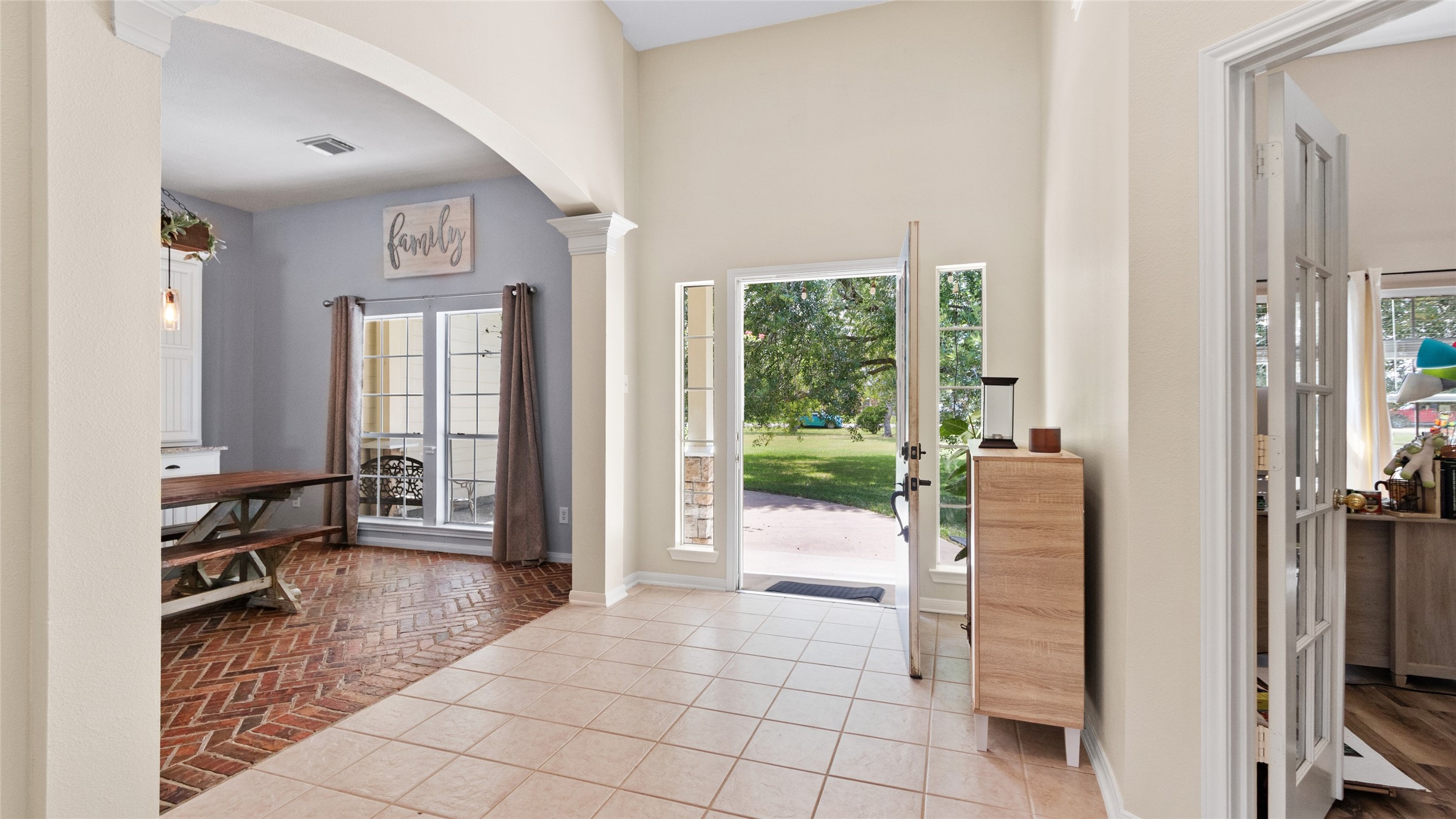 As you turn back toward the front door, youll see the dining room to the left and a flexible bedroom or office space to the right.