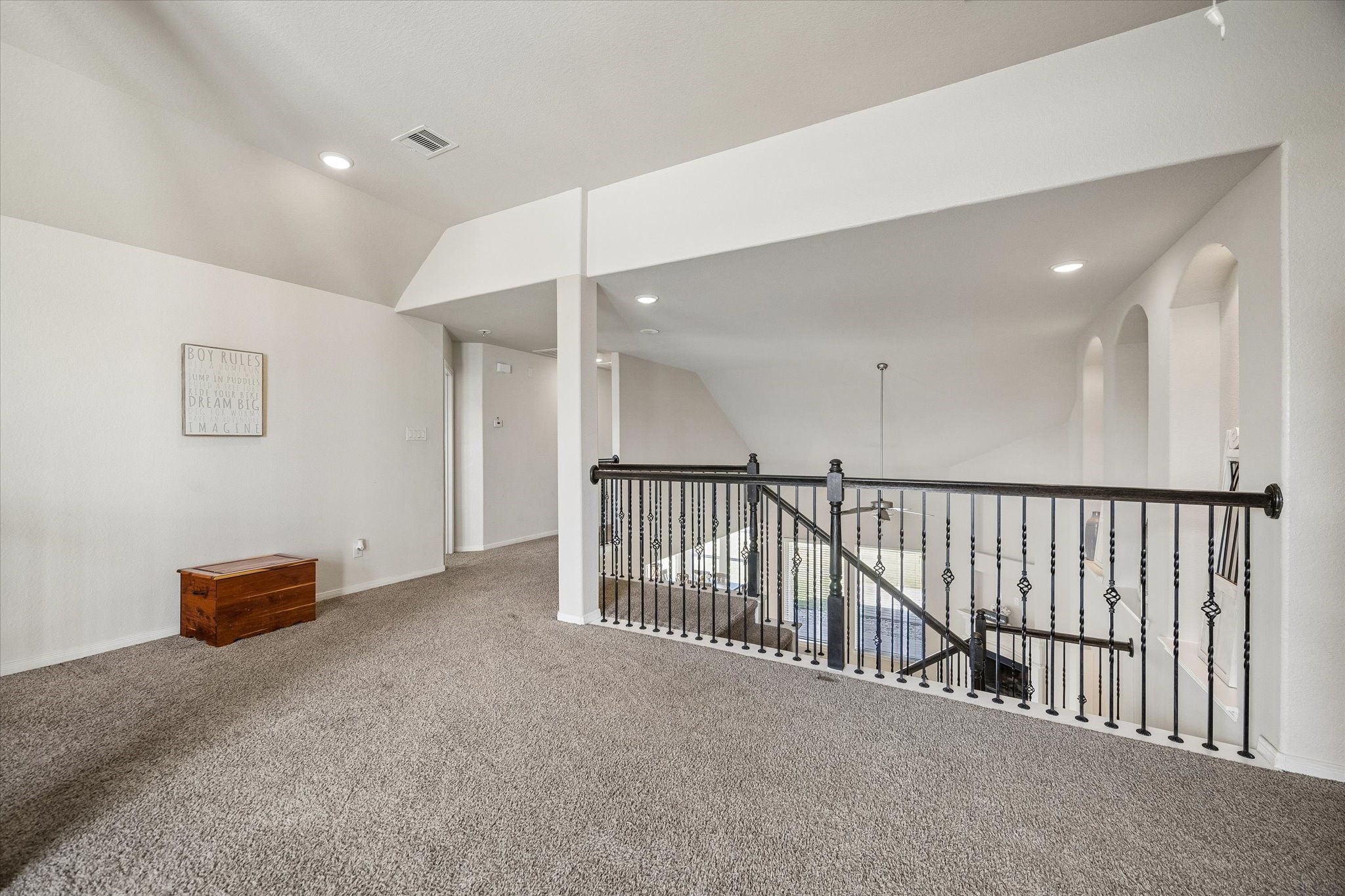Staircase opens up to the large game room upstairs.