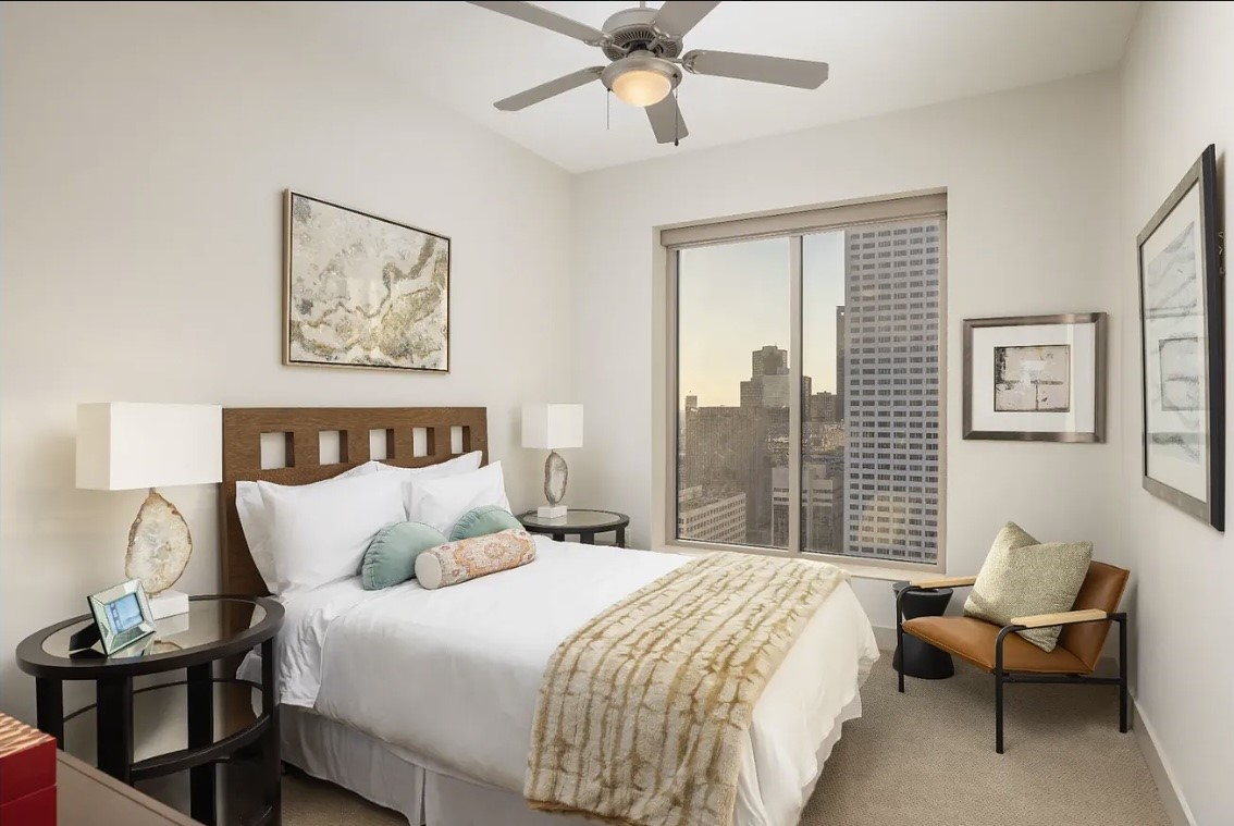 The spacious secondary bedroom offers comfort, flexibility and beautiful downtown views through oversized windows. Perfect for guests, family, or a home office, this thoughtfully designed space provides endless possibilities to fit your lifestyle.