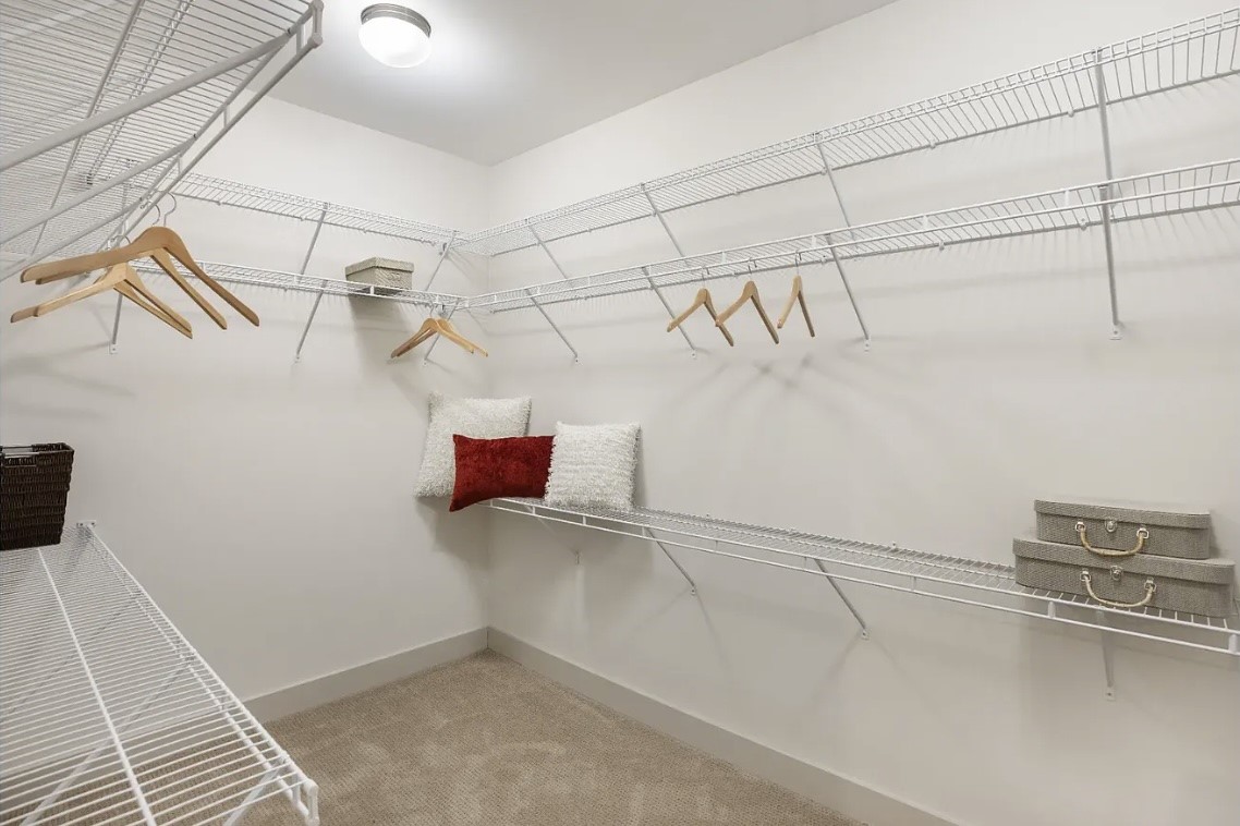Organization comes naturally in the spacious walk-in closet, featuring generous wraparound shelving and multiple hanging areas that provide ample space for clothing, shoes, accessories and more.