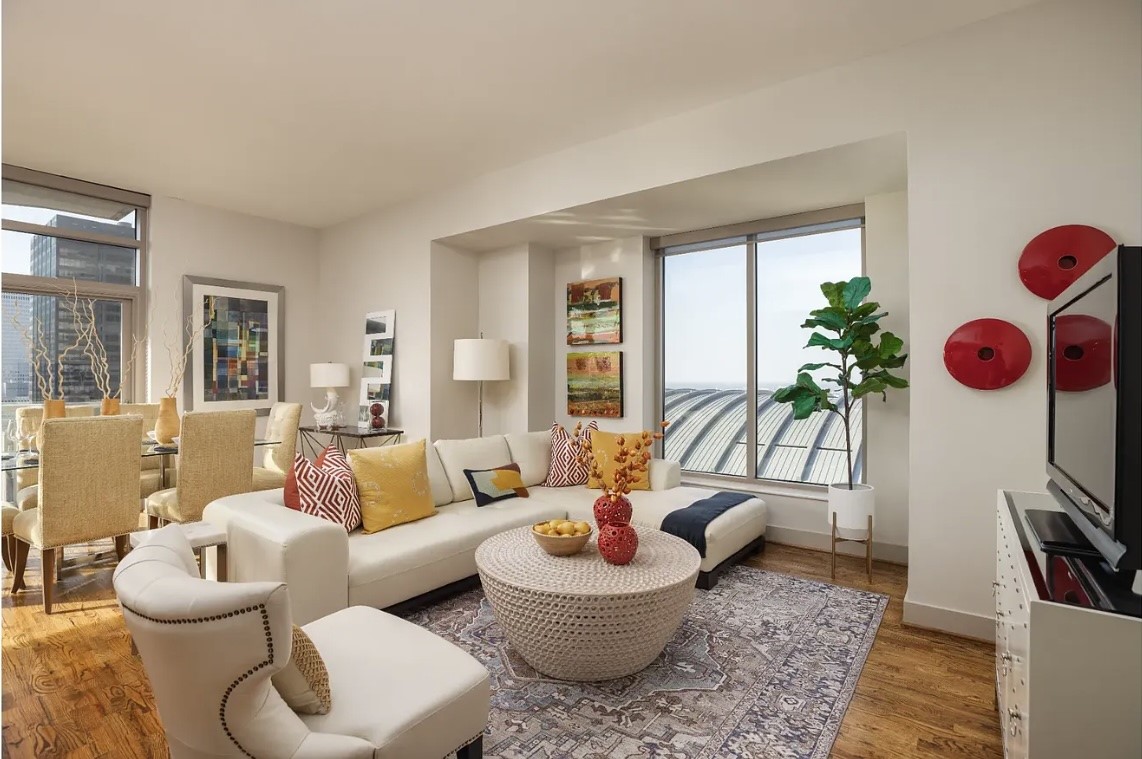 Designed for effortless everyday living, the sunlit open-concept layout seamlessly connects the living, dining, and kitchen areas, creating an inviting space for relaxing, entertaining or spending time with family. Expansive windows fill the home with natural light, enhancing the bright and airy atmosphere.