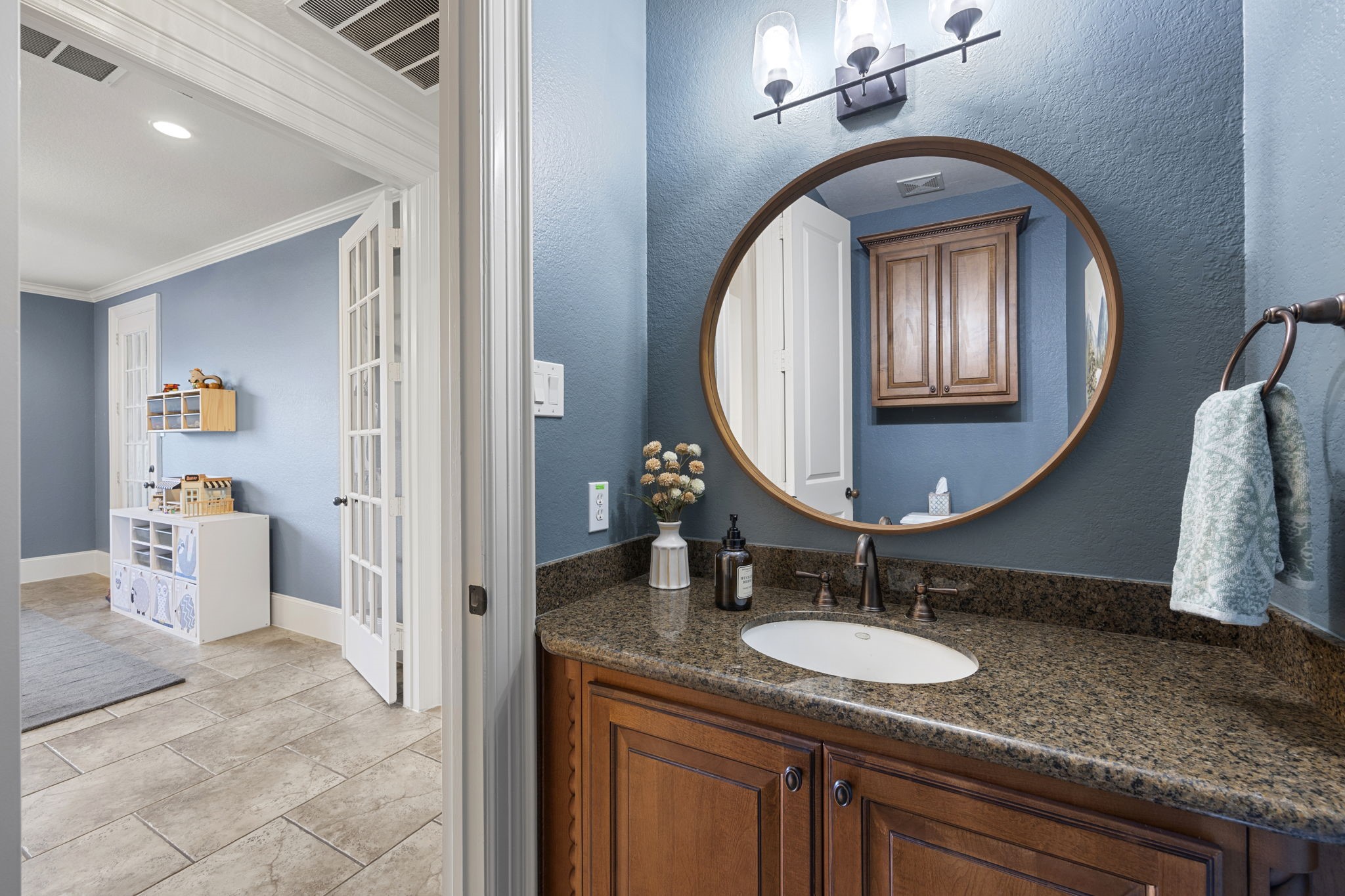 Half bathroom situated just outside the Game Room.