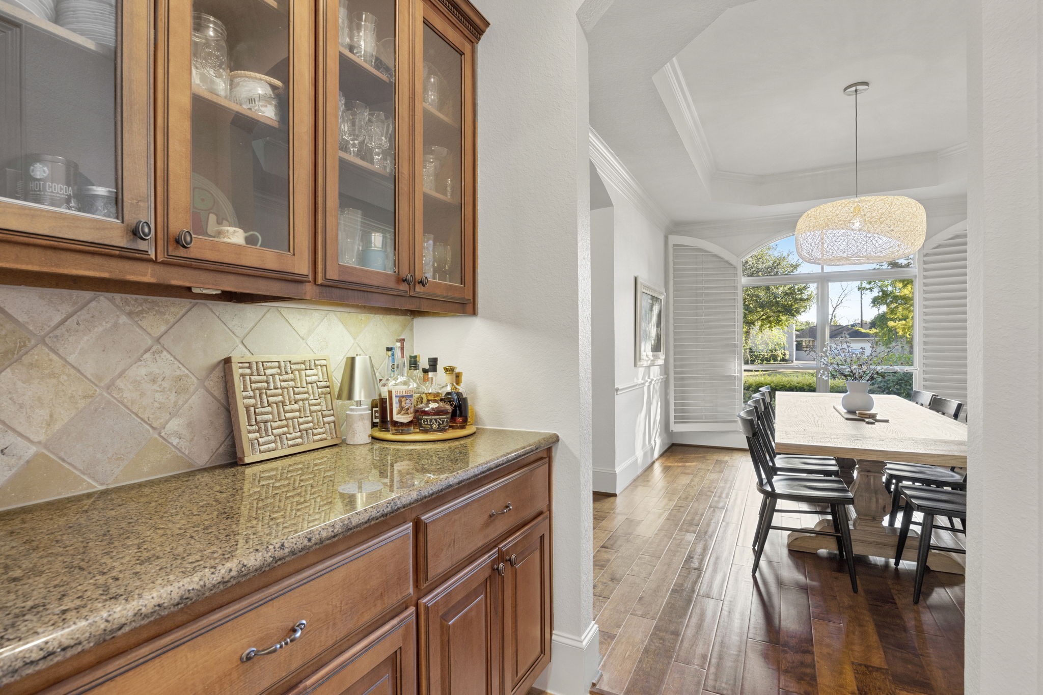 Helping transition the Formal Dining room into the kitchen is this super useful butlers pantry area! Need a spot for your adult beverages? Need a spot for your coffee bar...this area is thoughtfully designed just for that!