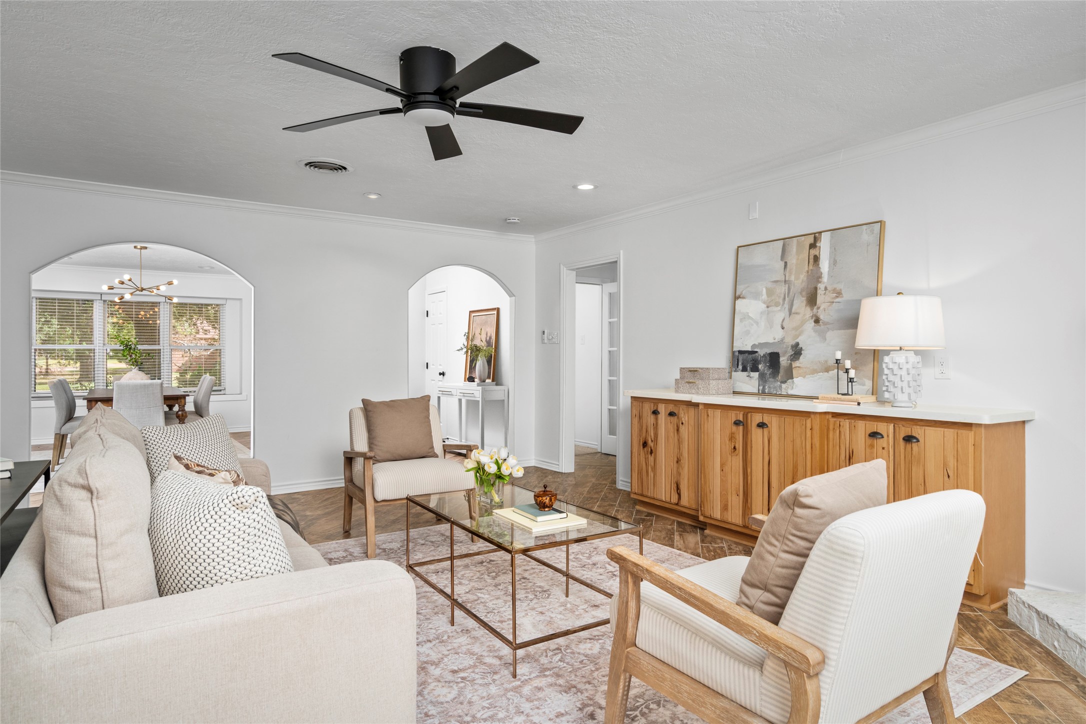 The inviting and cozy living room sits at the heart of this Shadow Oaks home