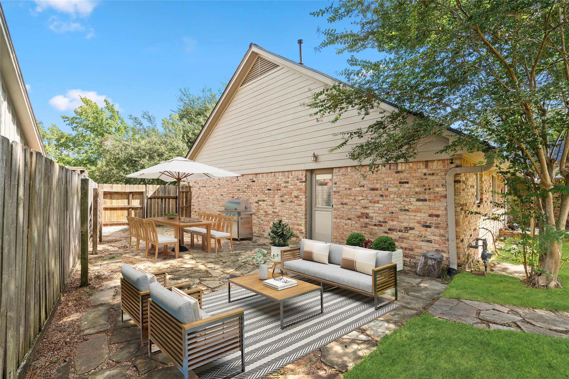 If you didn't think you had enough space, the side yard seemlessly connects the kitchen to a beautiful outdoor retreat! *virtually staged here