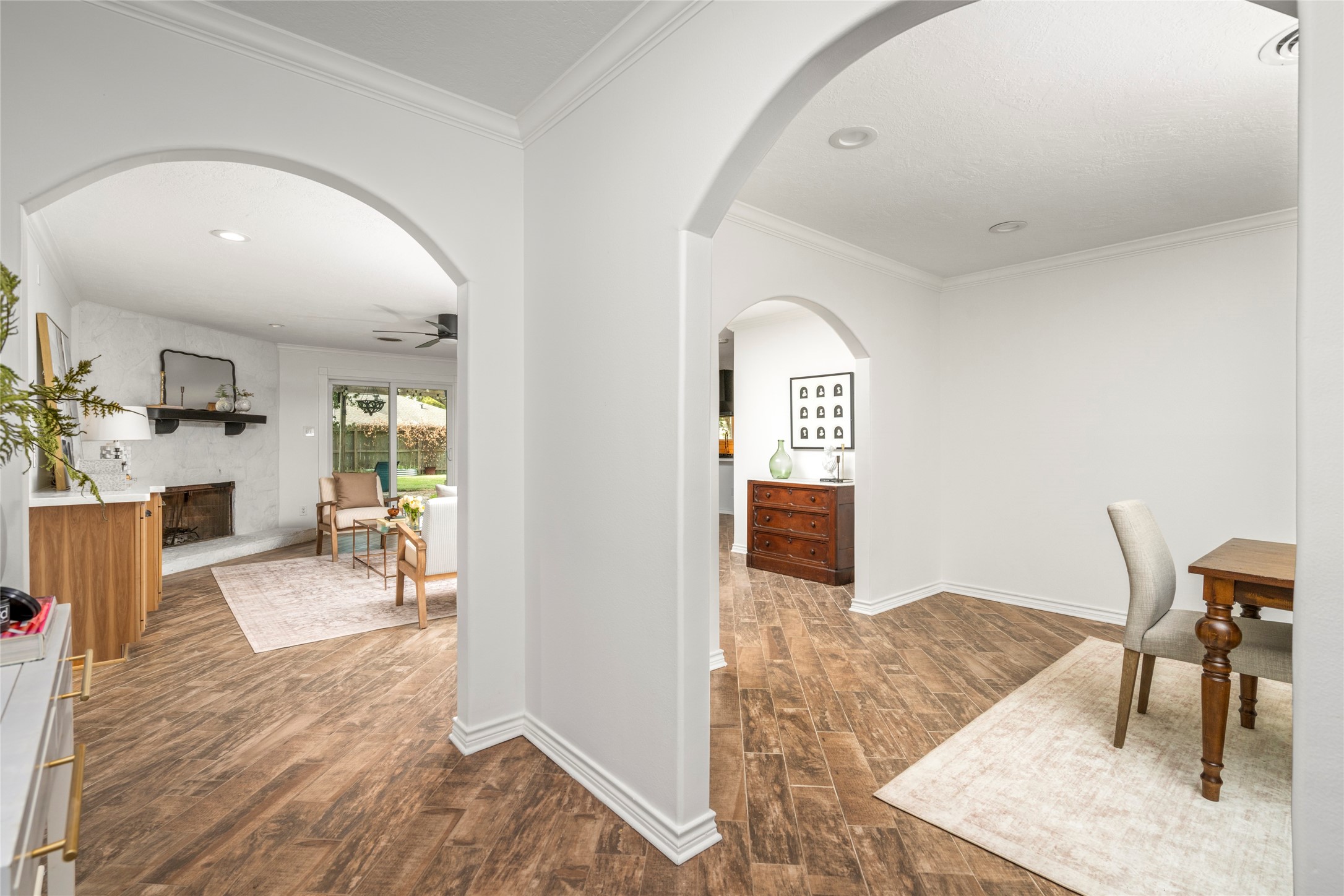 Enter the home to beautiful archways and an inviting living space