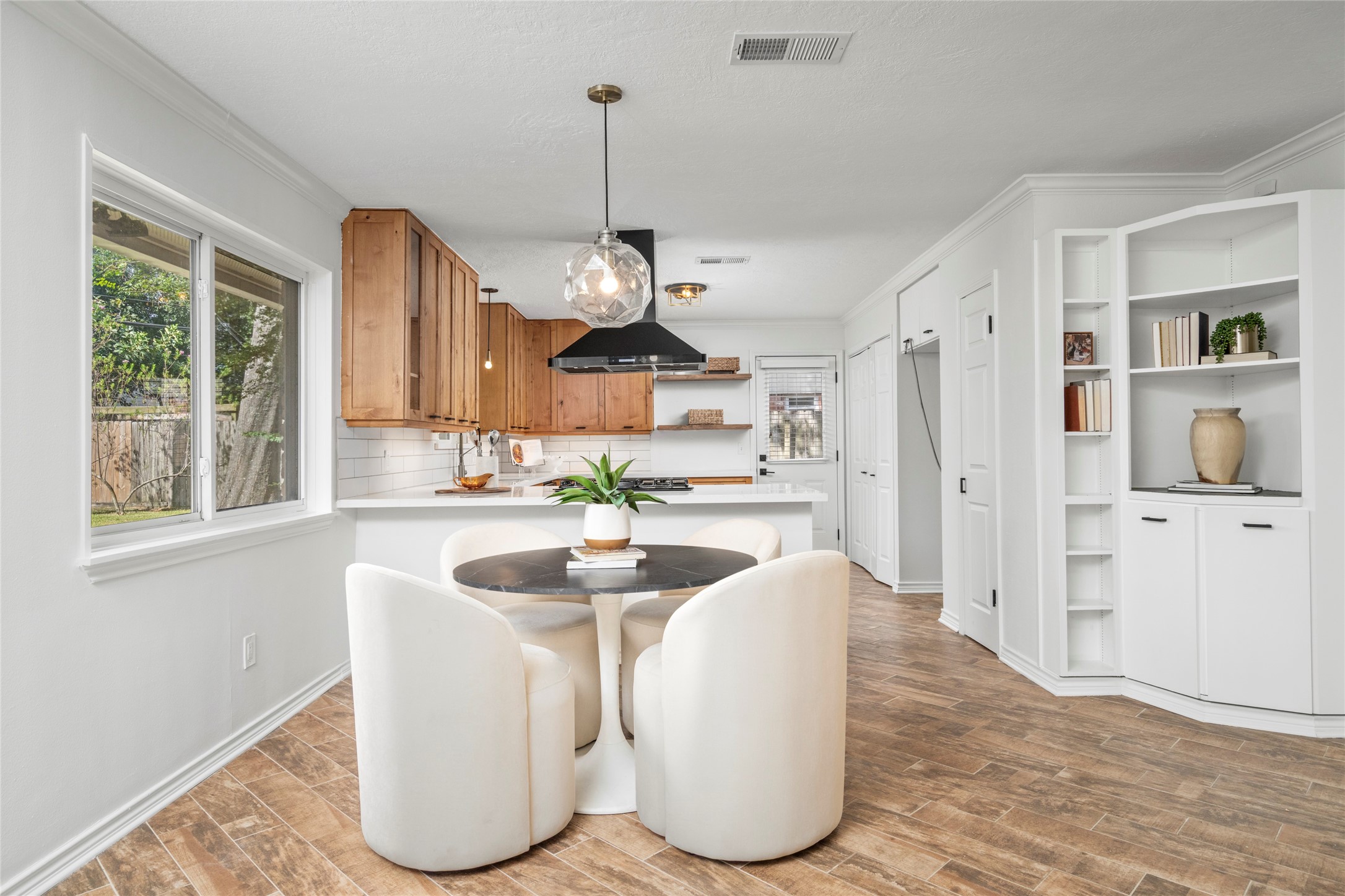 Breakfast nook or easy weeknight dining just off the kitchen allows functional living
