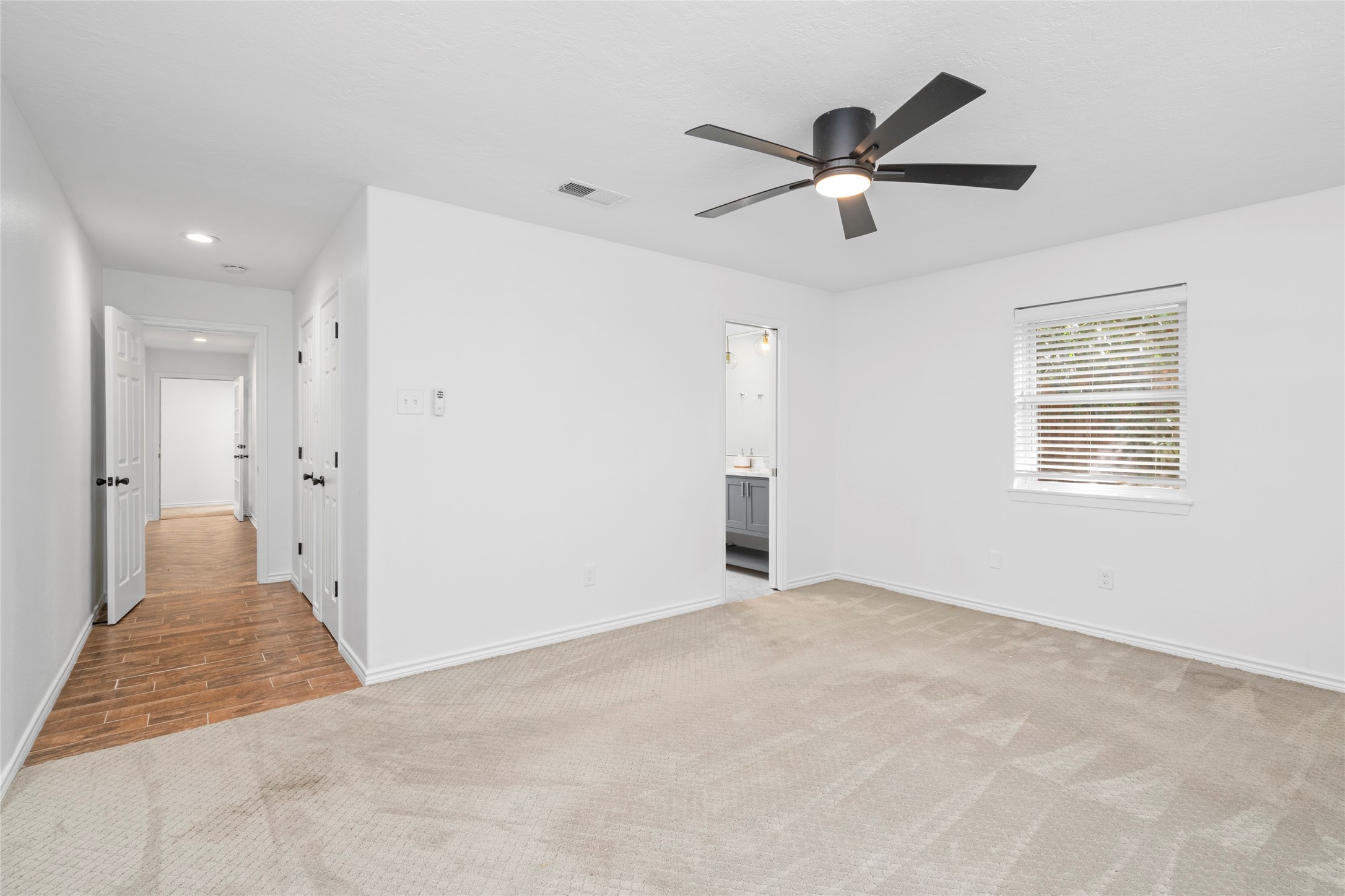 Alternate view of the entry to primary bedroom, closet and ensuite