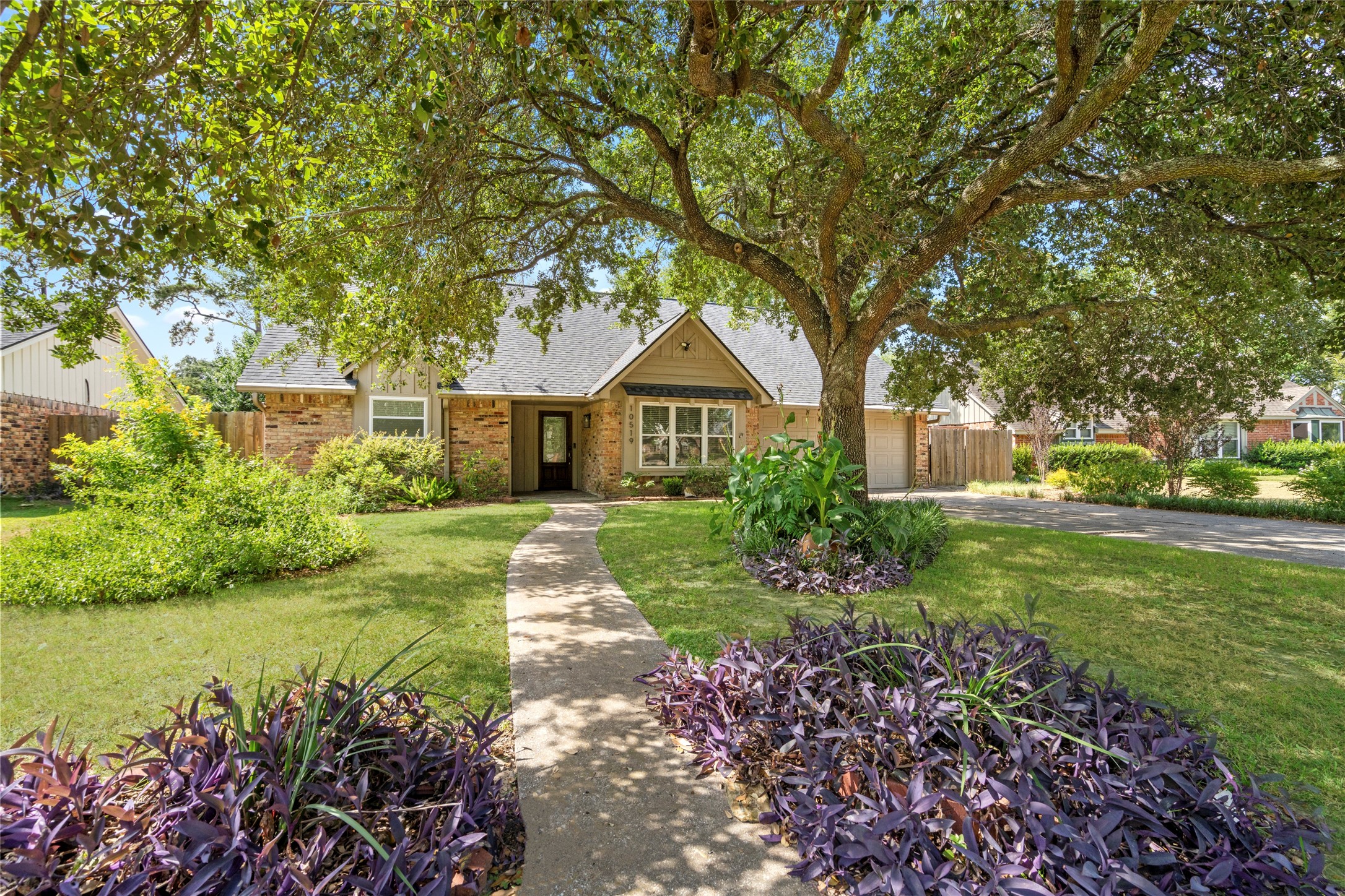10519 Londonderry - perfectly situated under a gorgeous shade tree and mature landscaping for the ultimate curb appeal.