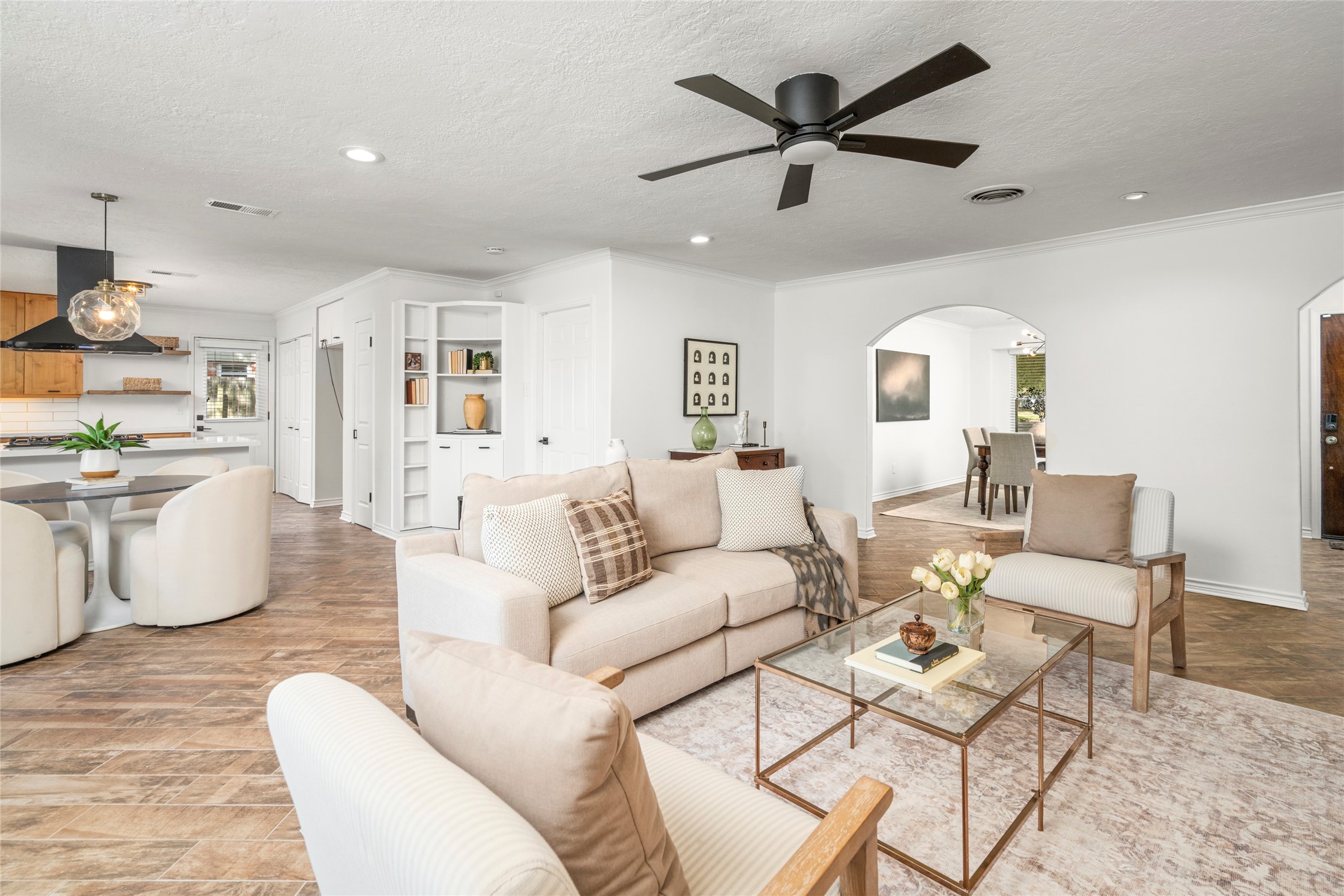 Alternate view of the living room, showcasing the flow toward breakfast nook and kitchen