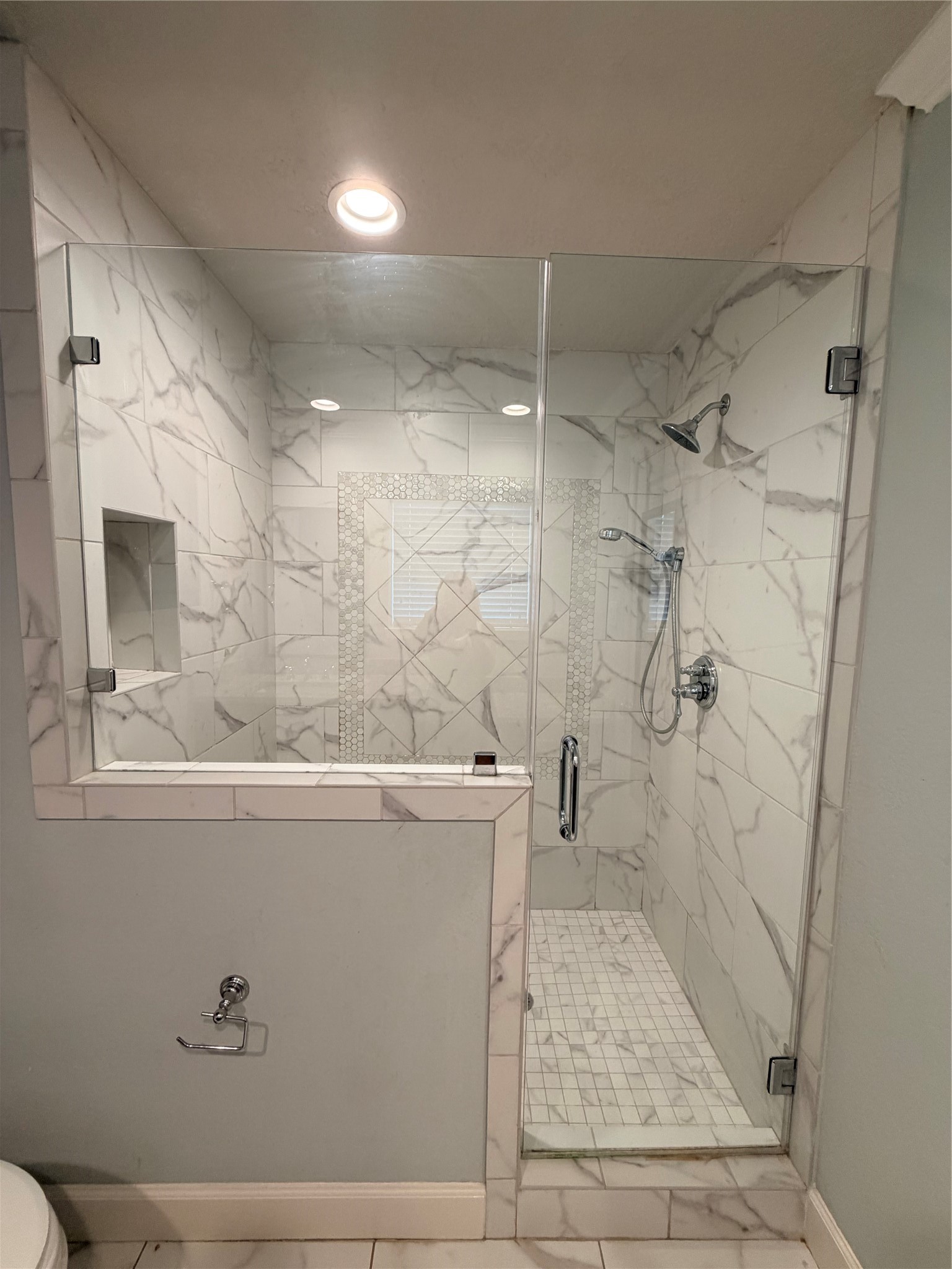 Custom remodeled porcelain and marble shower