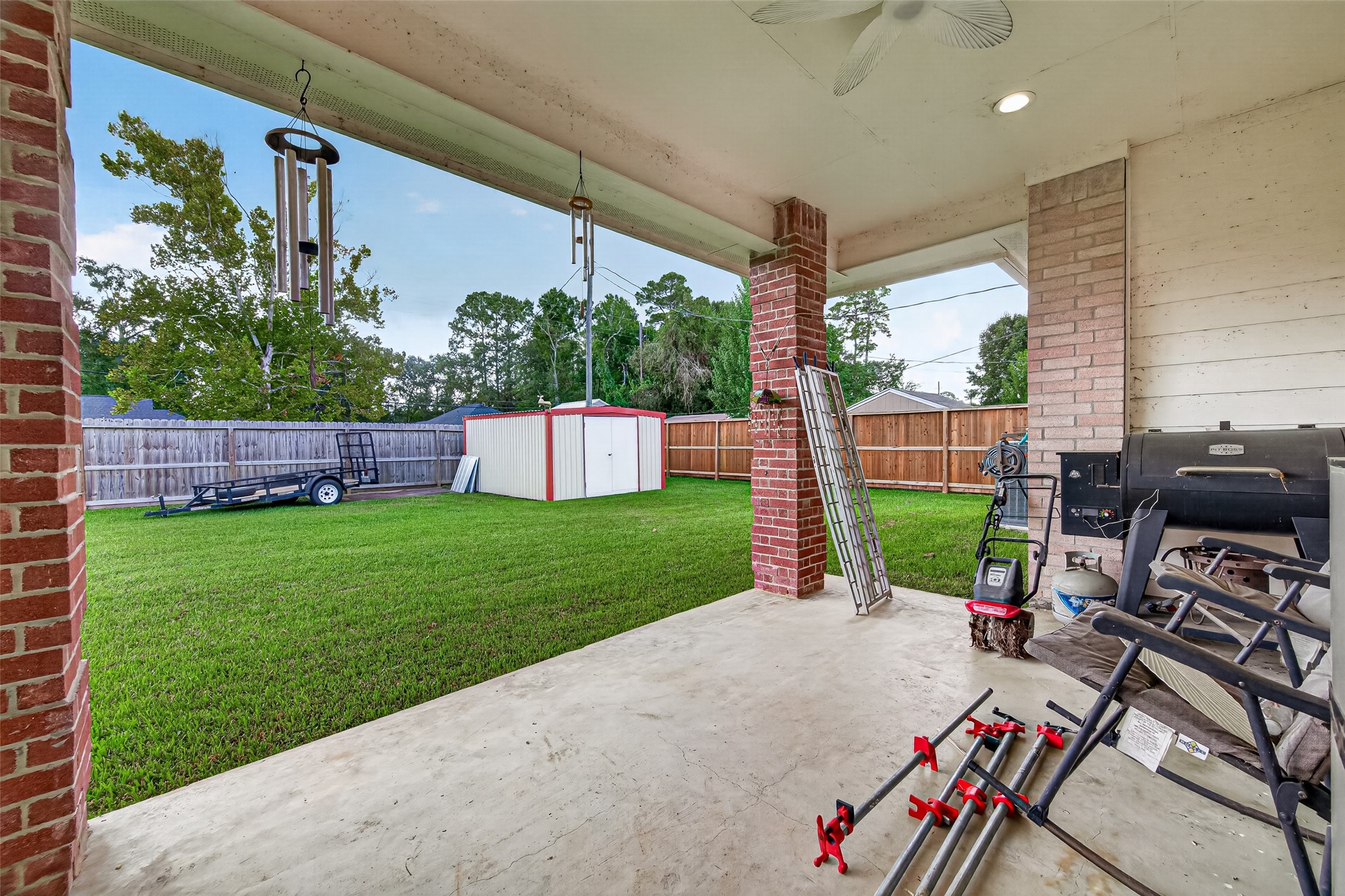 The perfect spot for morning coffee or evening relaxation! Covered patio overlooking the expansive, fully fenced backyard.
