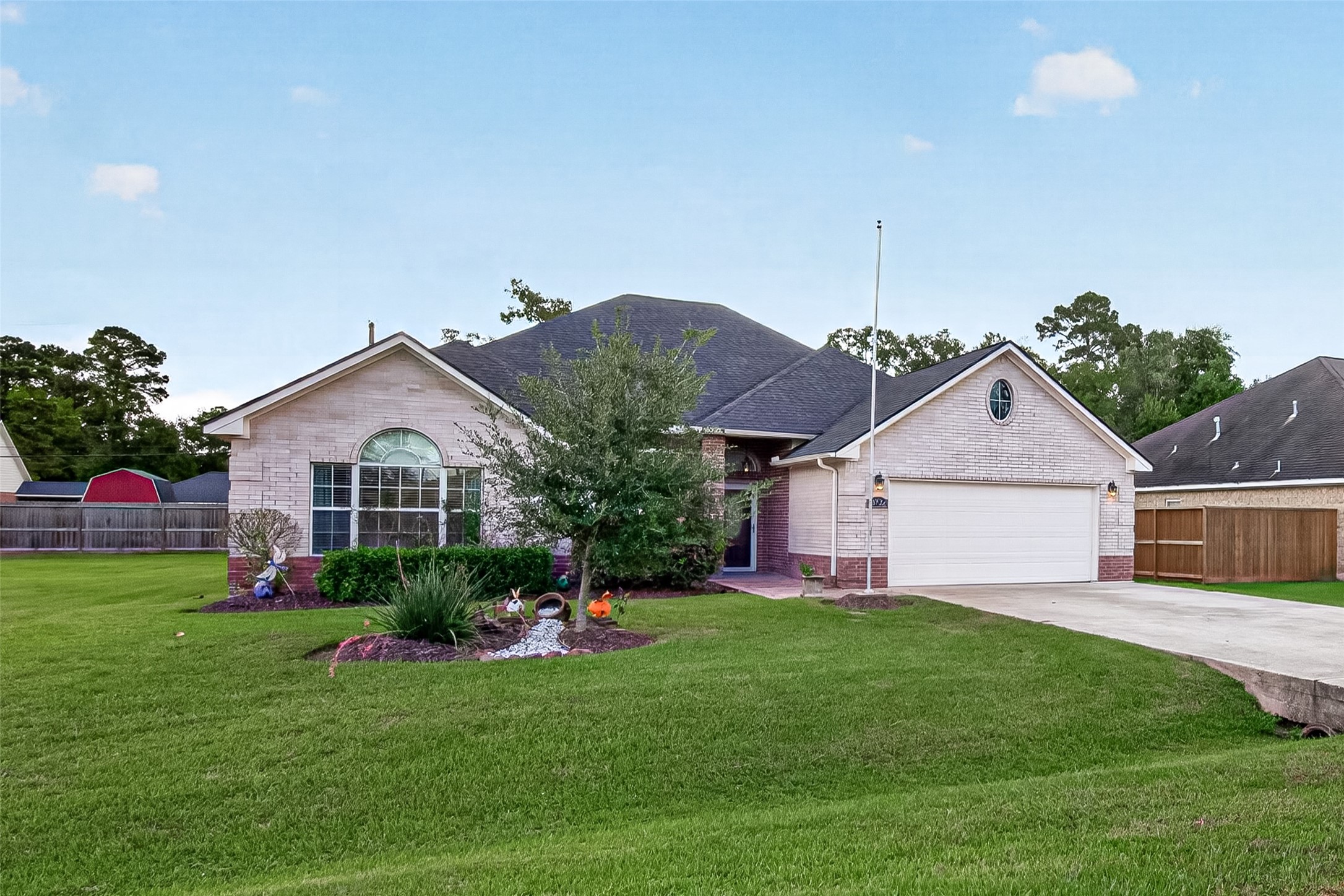 Charming curb appeal with an inviting entrance and well-maintained landscaping.