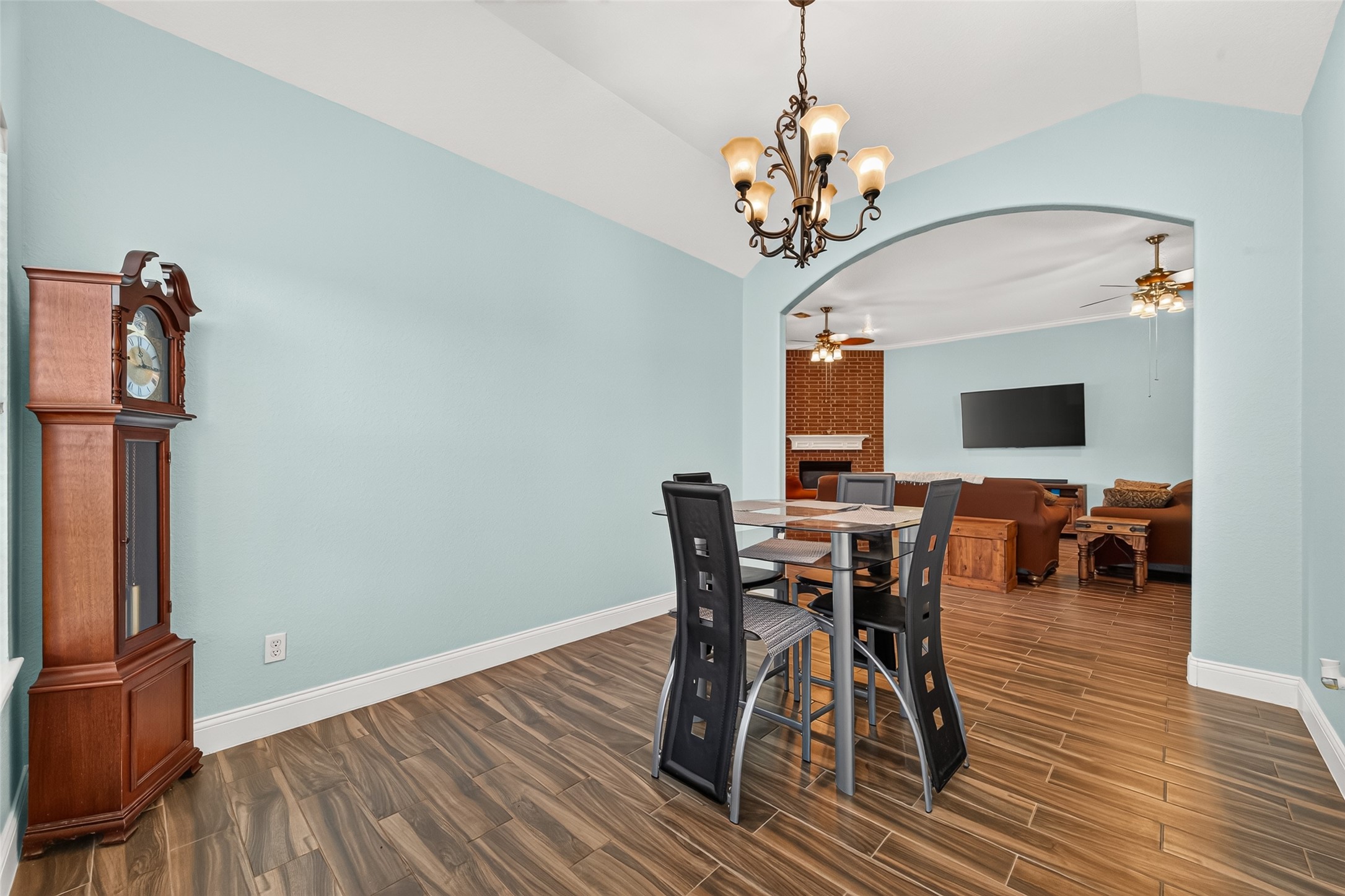 Another view of the formal dining room showcasing the open entryway leading into the spacious living area