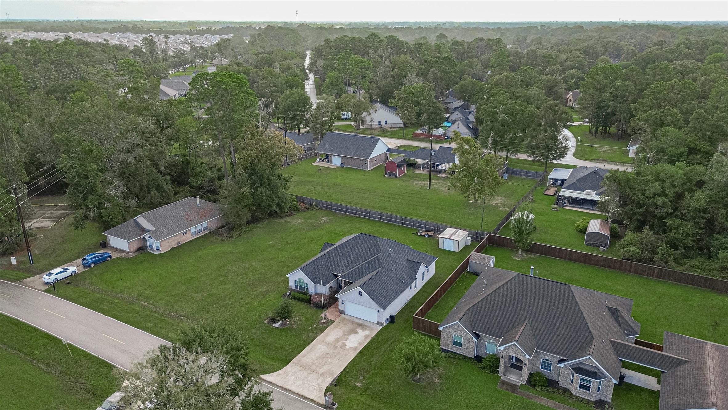 Elevated view of the home and surrounding properties, offering a great perspective of the established Lake Shadows community.