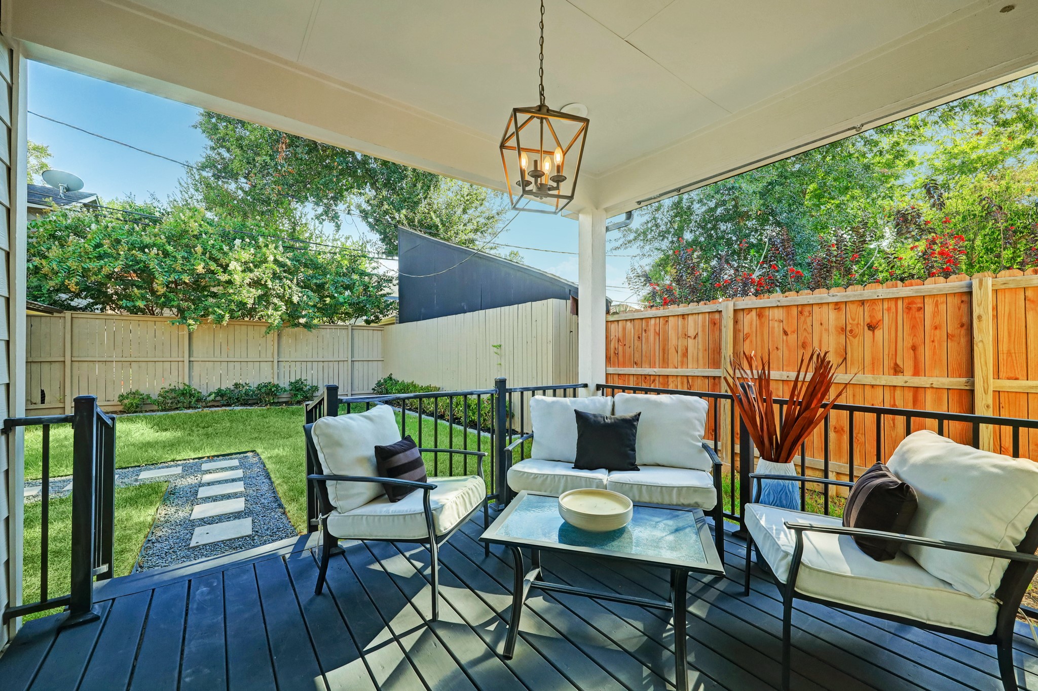Covered back patio overlooking the spacious, fully fenced backyard