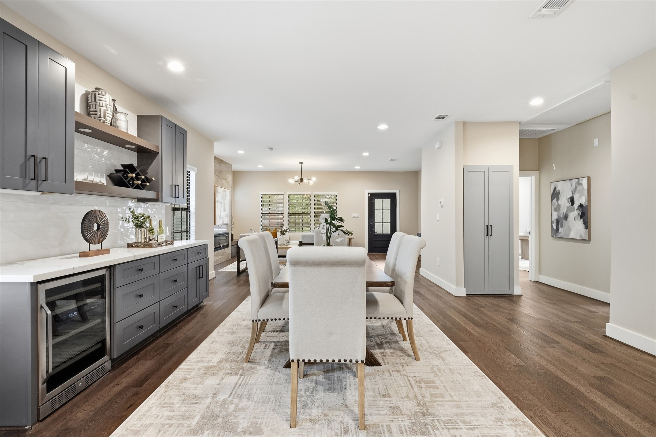 Stylish dining area with custom cabinetry and a built-in beverage refrigerator