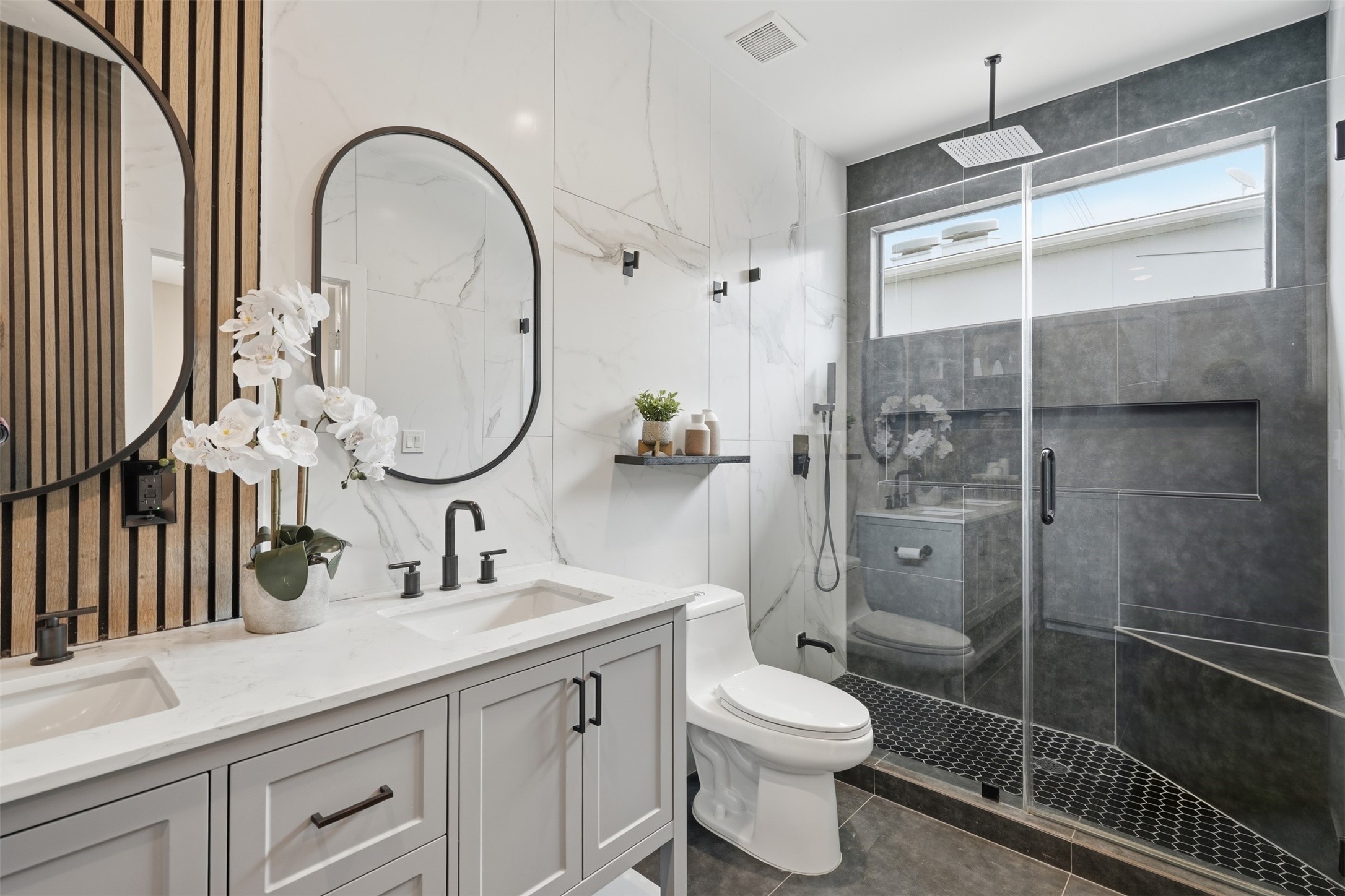 Spa-inspired bathroom with modern finishes and a spacious glass-enclosed shower