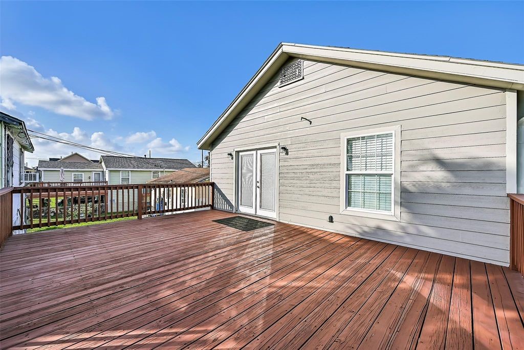 Large outdoor patio that oversees the spacious backyard and additional staircase. Great for hosting guests or just enjoying the weather.