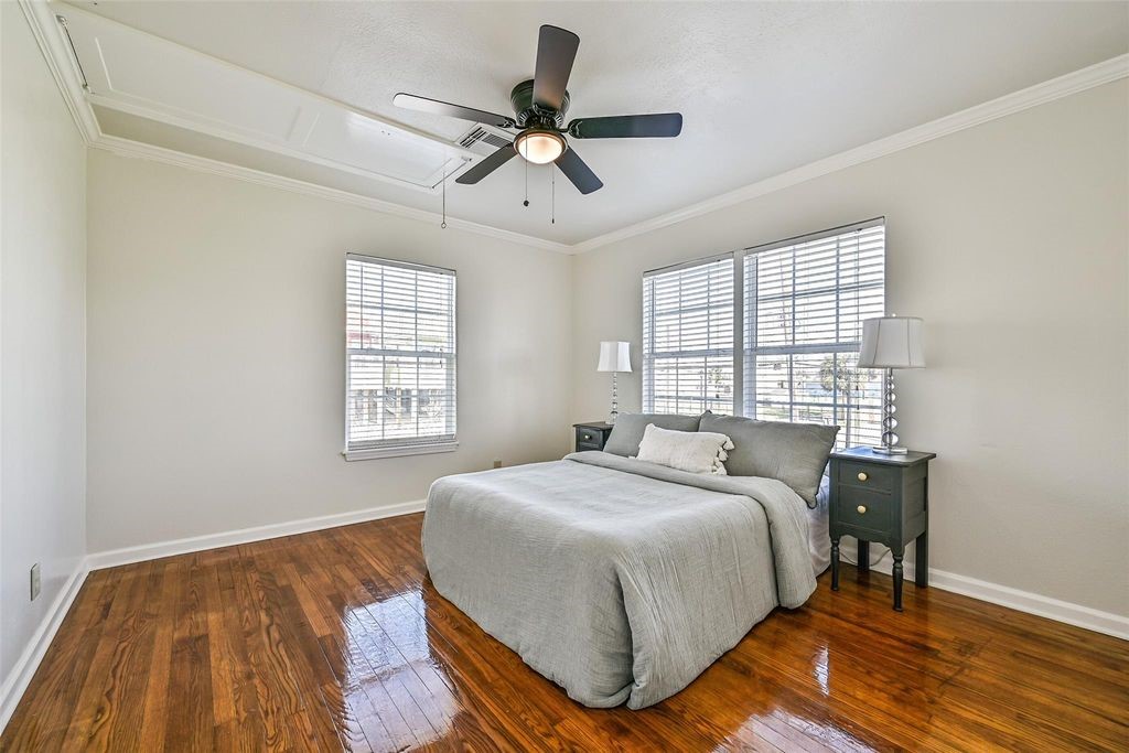 Second bedroom with two windows allowing plenty of light to come in. Both bedrooms featuring new ceiling fans and lgiht fixtures.