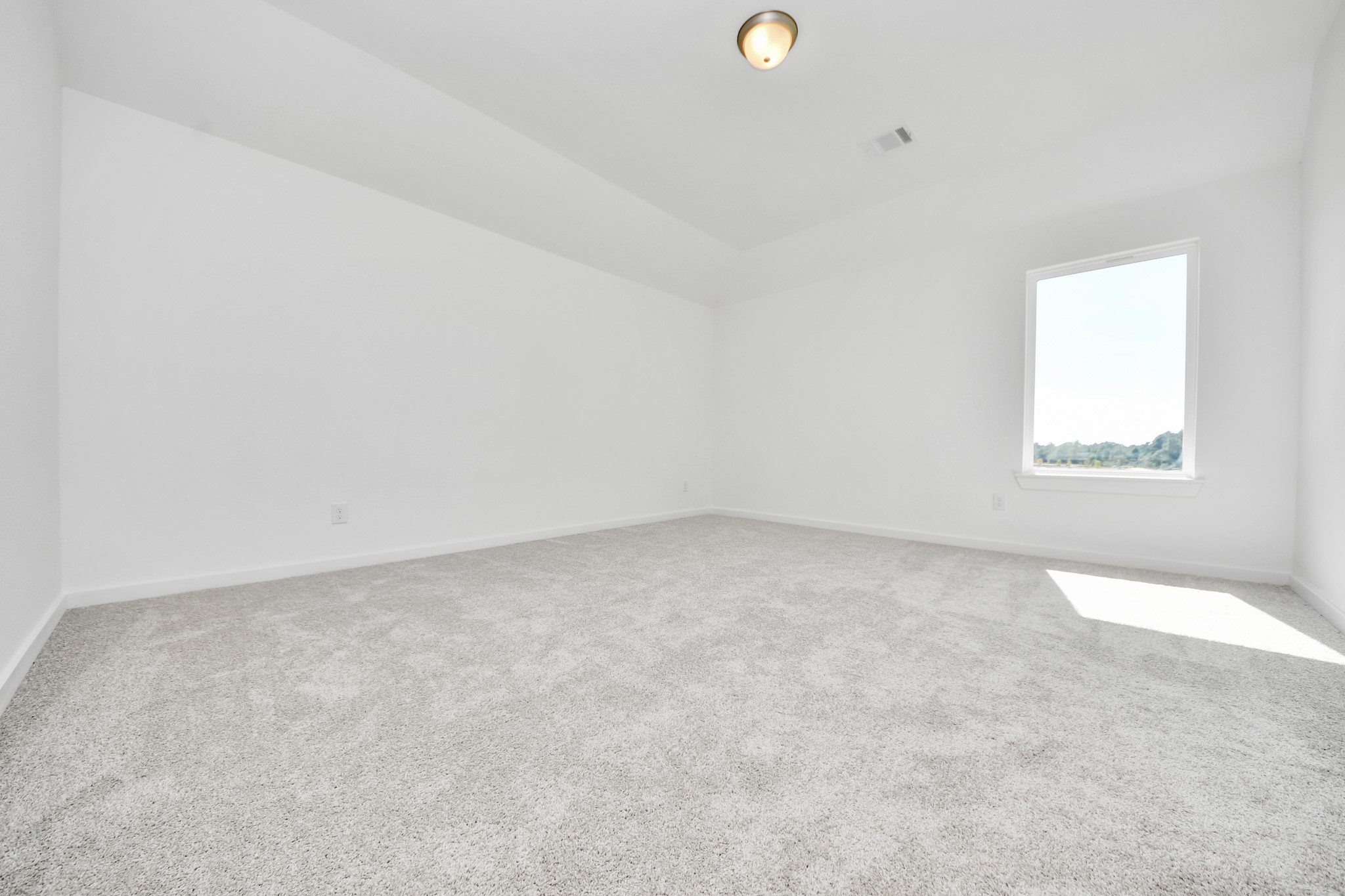 Ascend to relaxation in this fantastic game room! Ideal for both casual gatherings and adult gaming, it boasts plush carpet, lofty ceilings, custom paint, and ample windows for abundant natural light