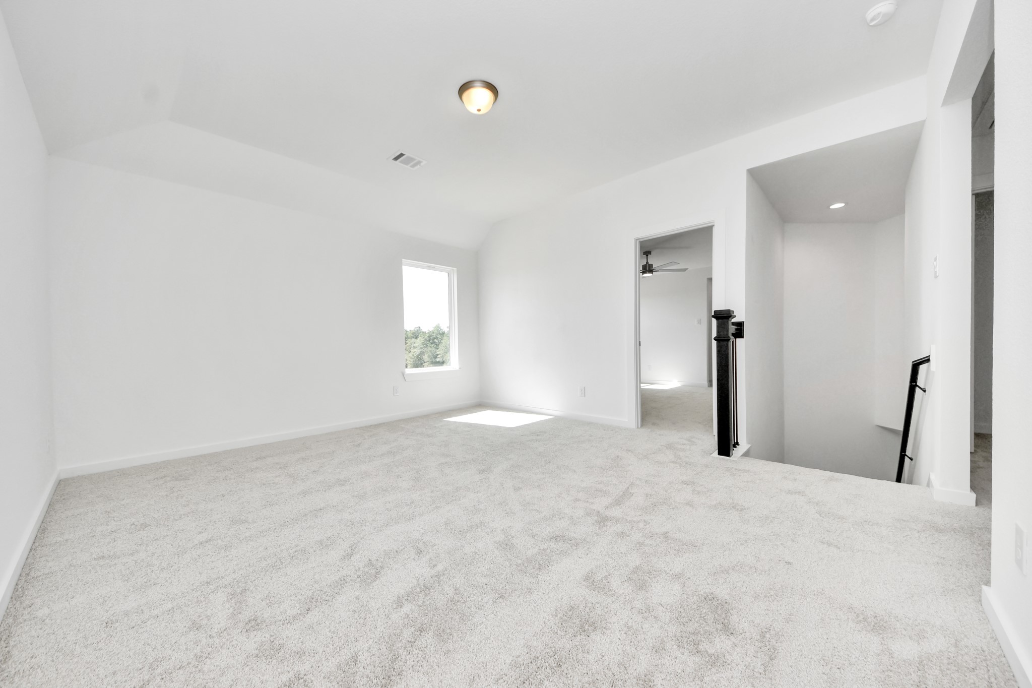 Come upstairs and enjoy a day of leisure in this fabulous game room! This is the perfect hangout spot or adult game room! Features plush carpet, high ceilings, custom paint and windows for plenty of natural light.