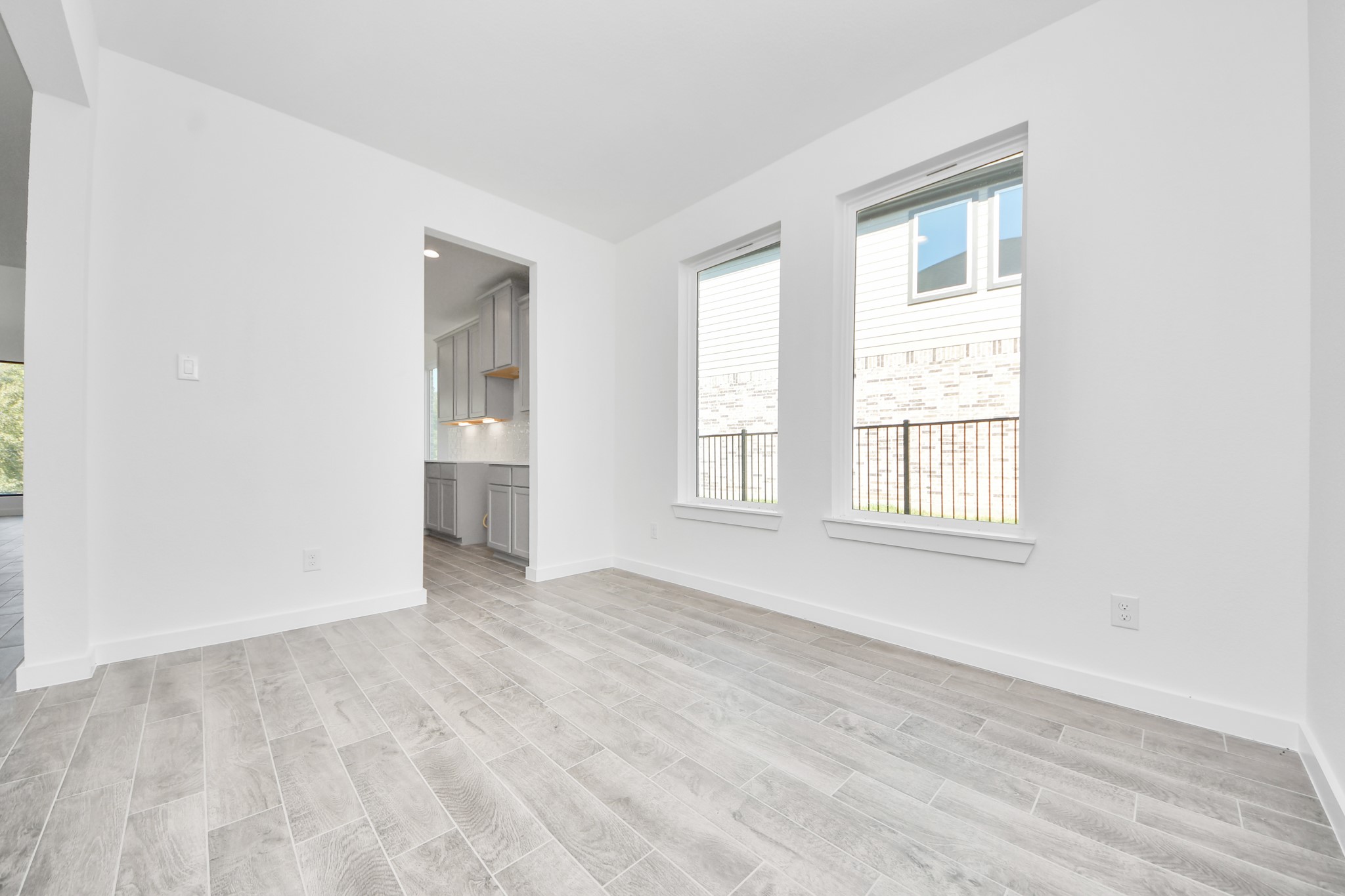 Make memories gathered around the table with your family and friends! This spacious dining room features elegant flooring, custom paint, and adjacent to family room and kitchen for open concept feel.