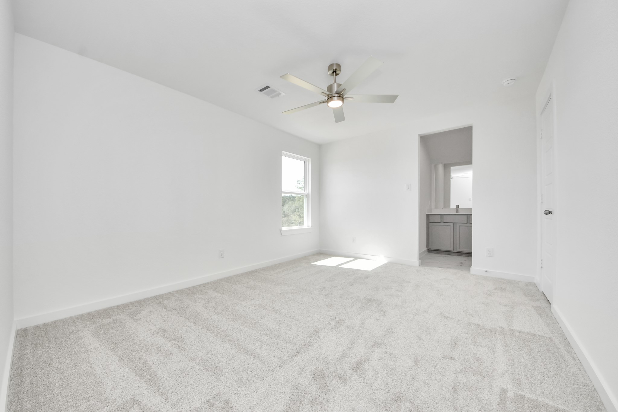 Generously sized secondary bedrooms featuring spacious closets, soft and inviting carpeting underfoot, large windows allowing plenty of natural light, and the added touch of privacy blinds for your personal retreat.