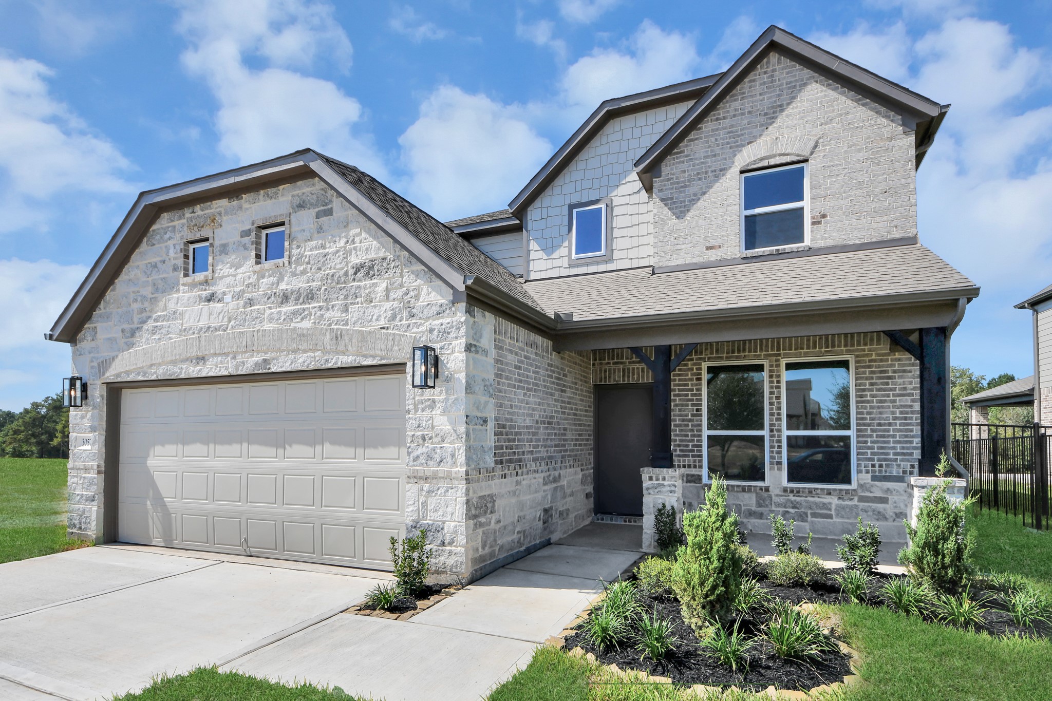 Home features a convenient 2-car garage complemented by a spacious driveway, offering ample parking for you and your guests.