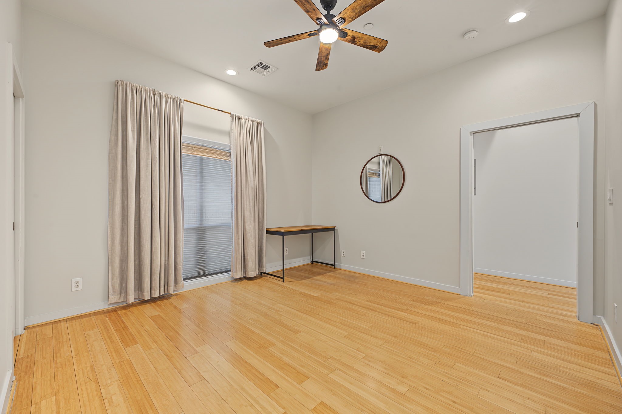 Contemporary Comfort!  Retreat to the comfort of this stylish bedroom, where beautiful bamboo wood flooring and a sunny window create a warm, inviting atmosphere!