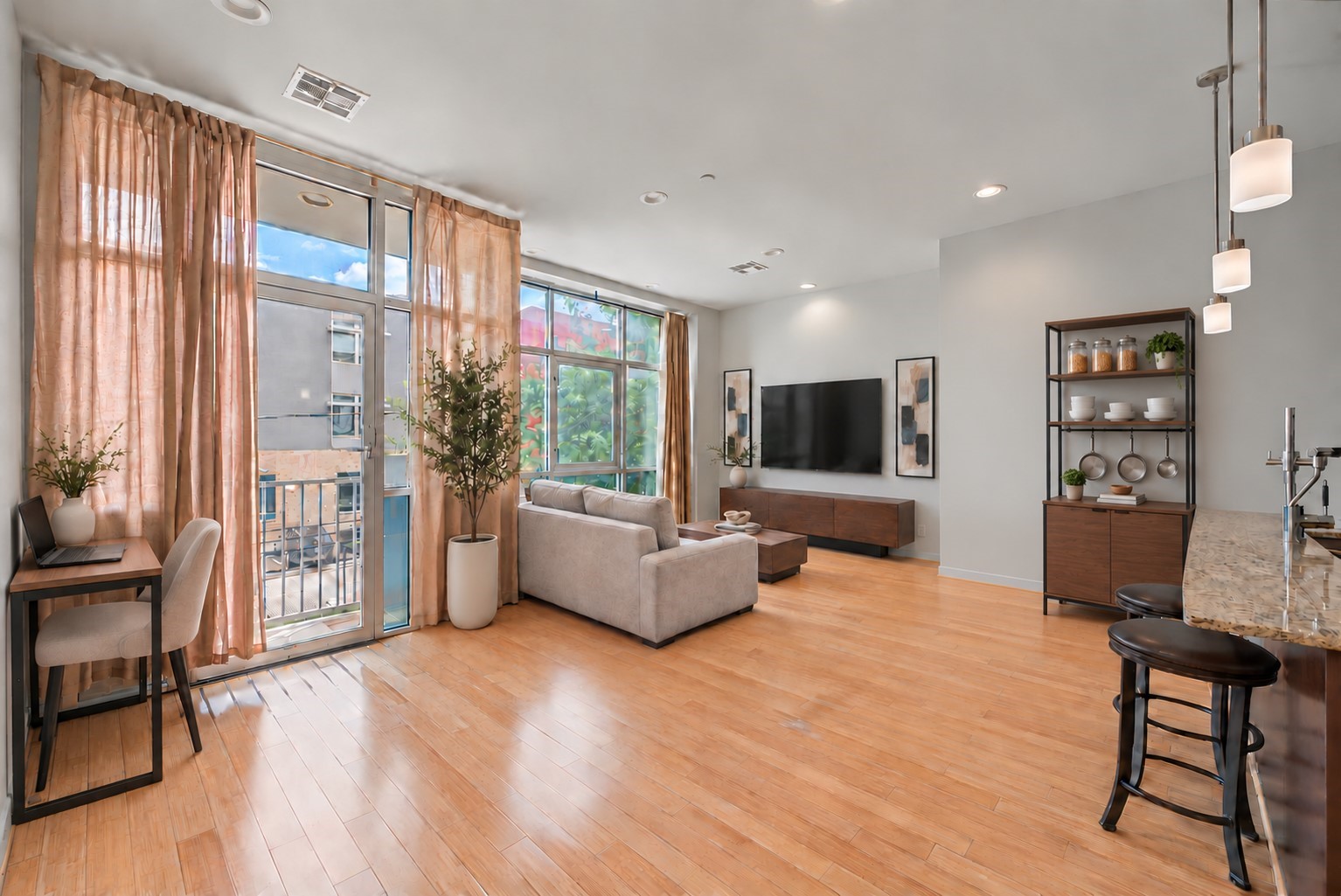A virtually-staged representation of the two living/work areas.